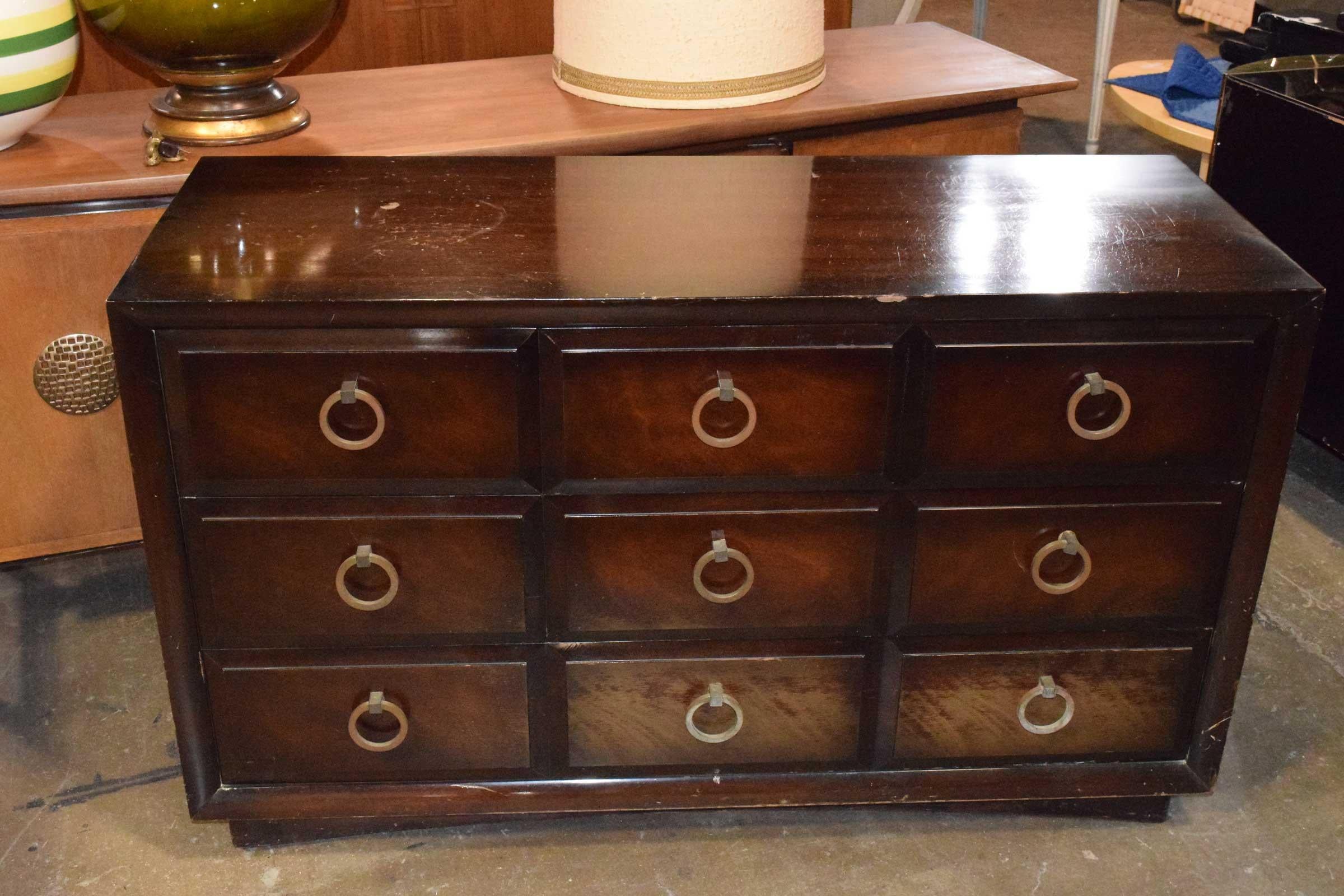 Beautifully made chest of drawers, on casters for easy moving. This make a great dresser or chest for anywhere needed including an entry. Chests has five drawers with two on first two rows and bottom is a single drawer. Hardware is solid brass.