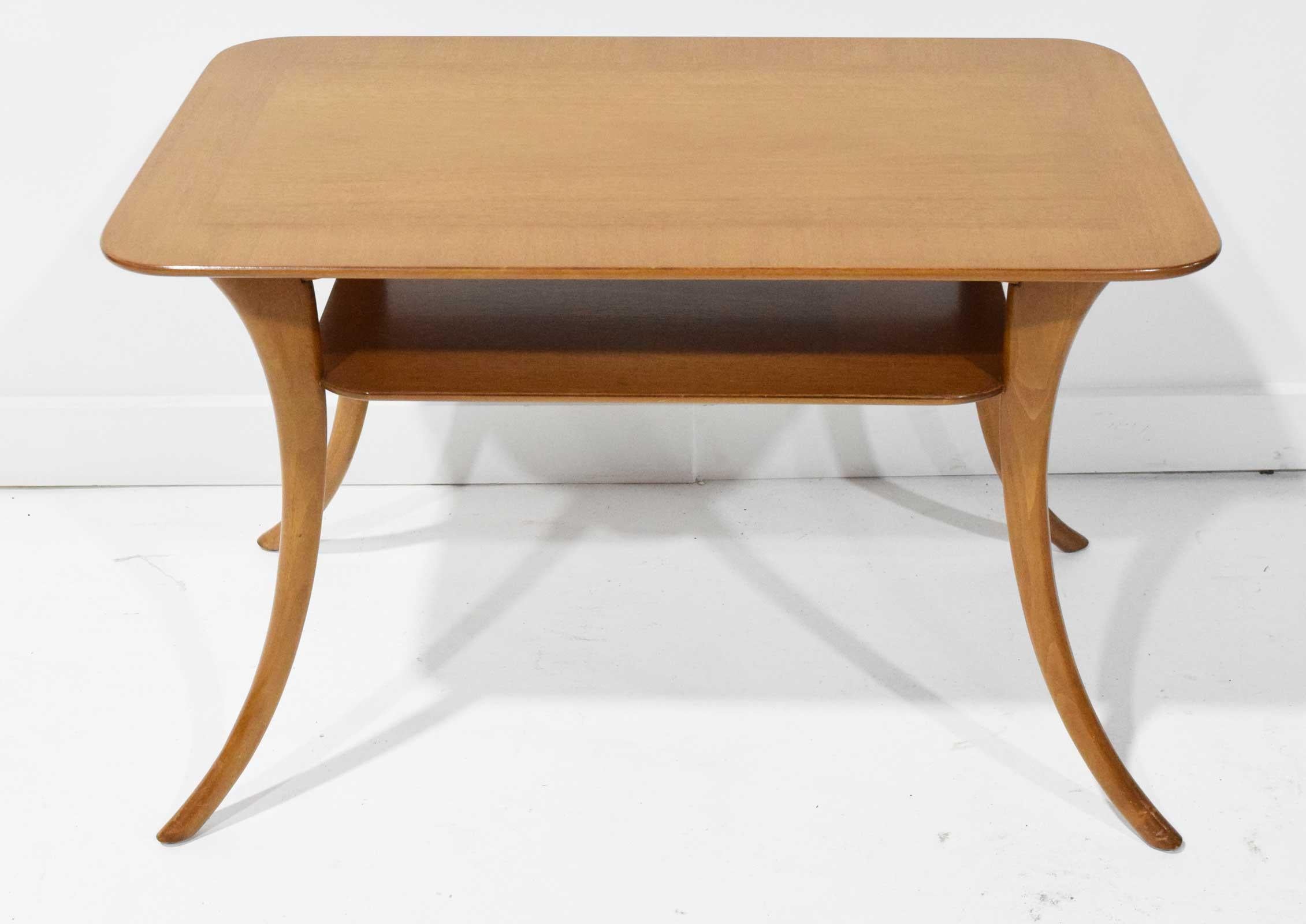 Mid-Century Modern walnut klismos leg coffee table or cocktail table designed by T.H. Robsjohn-Gibbings for Widdicomb furniture. Elegant and graceful square top with a two-tier design supported by splayed klismos style legs. The table retains its