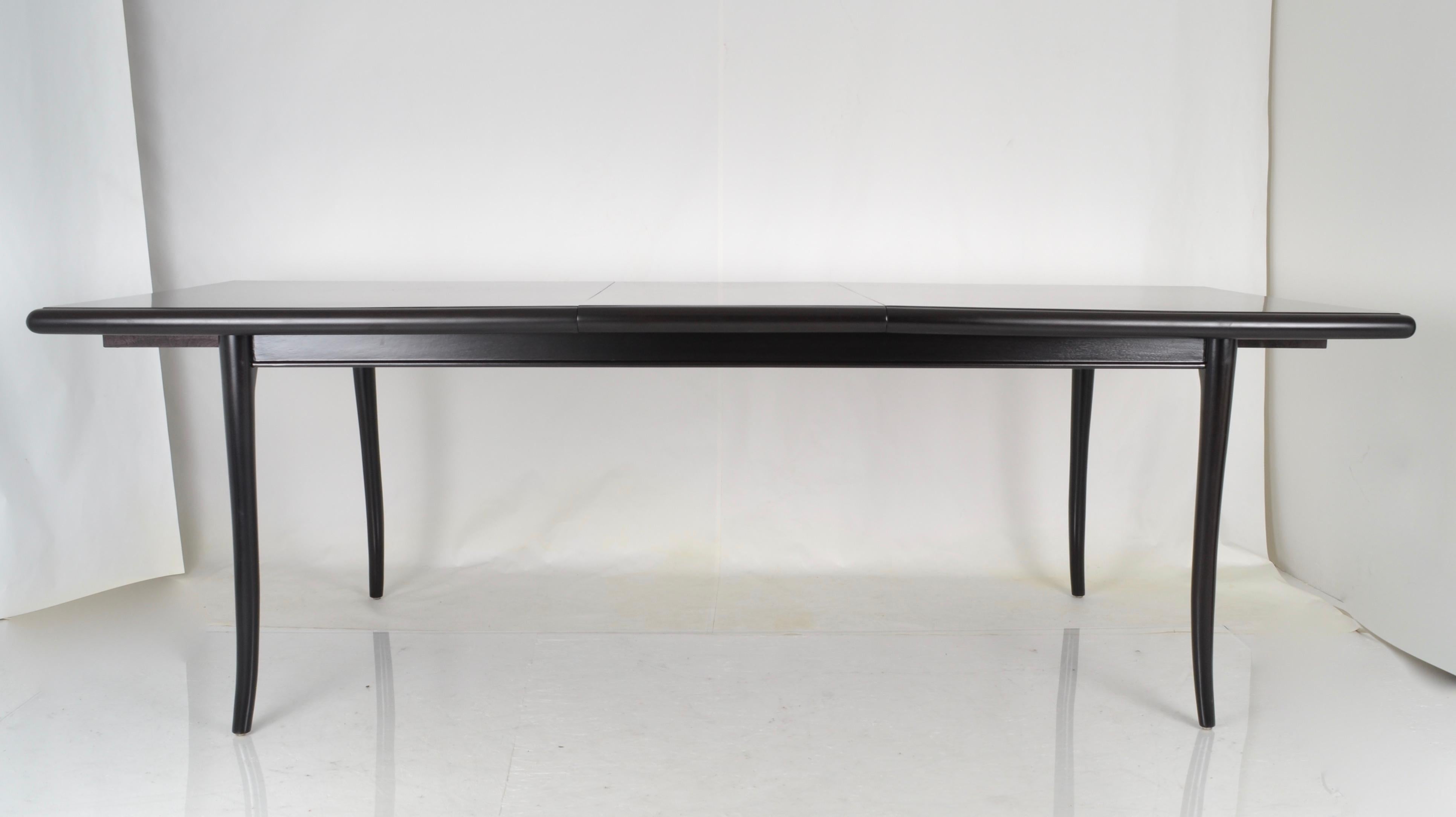 Great form on this dining table. Fully restored with new black/brown satin finish. Single leaf allows the table to extend to 92