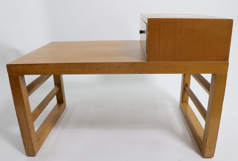 Architectural mid-century step end table designed by Robsjohn - Gibbings, manufactured by Widdicomb. This example is selling as is and as found, please see images. 
 Top section 11.5 in. inches D x 20 W inches.
 Total H 22.5 x 32 D x 20 W inches.