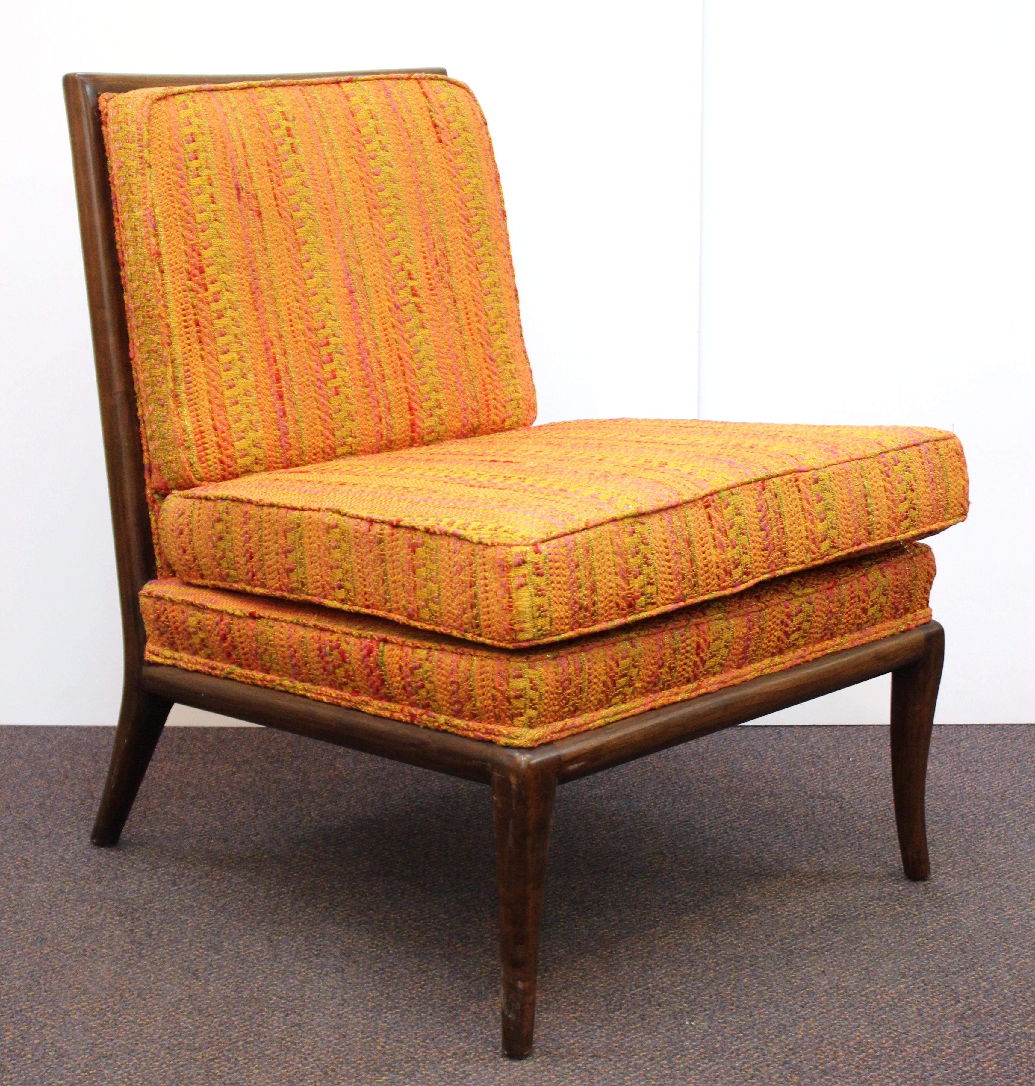 American Mid-Century Modern pair of slipper chairs designed by Robsjohn-Gibbings in the 1950s for Widdicomb. The chairs are crafted in mahogany and have been recently reupholstered with their original fabric.