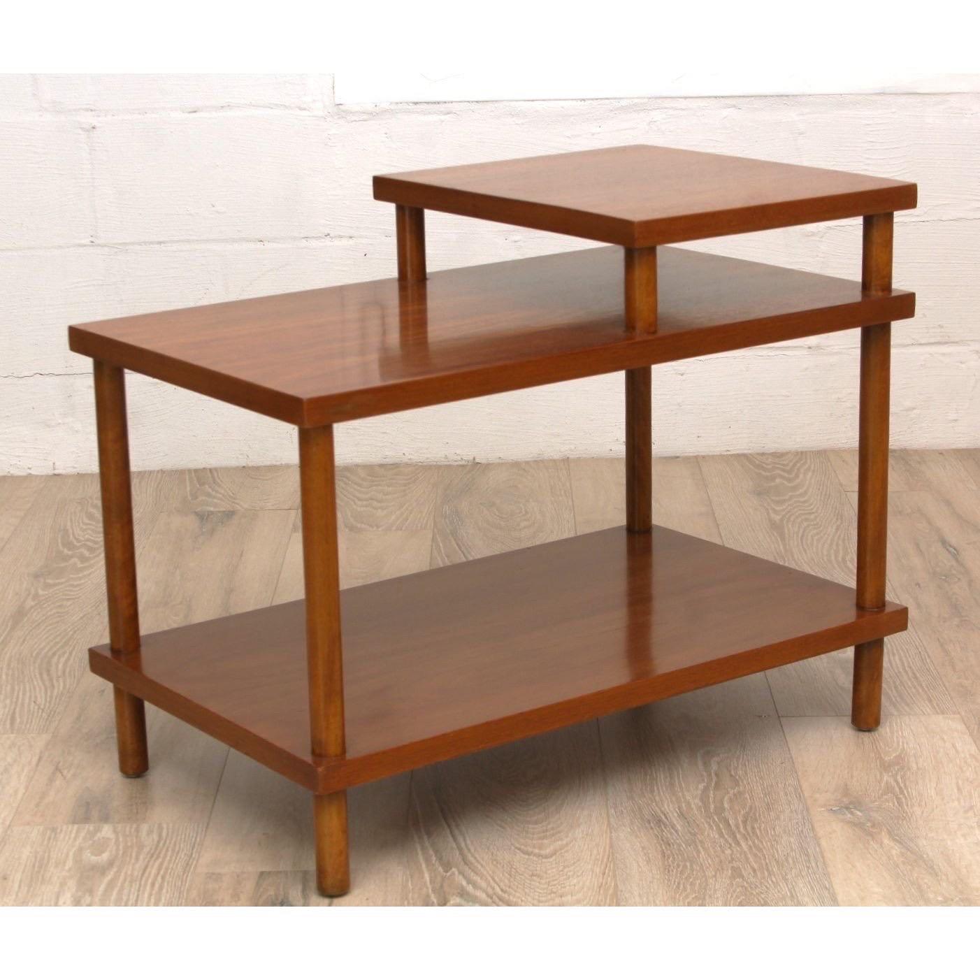 A three tier en table by TH Robsjohn-Gibbings for Widdicomb.

Moel 1756.

Dimensions: 18” L x 30” W x 24” H
Lower Tier: 19.5” H

