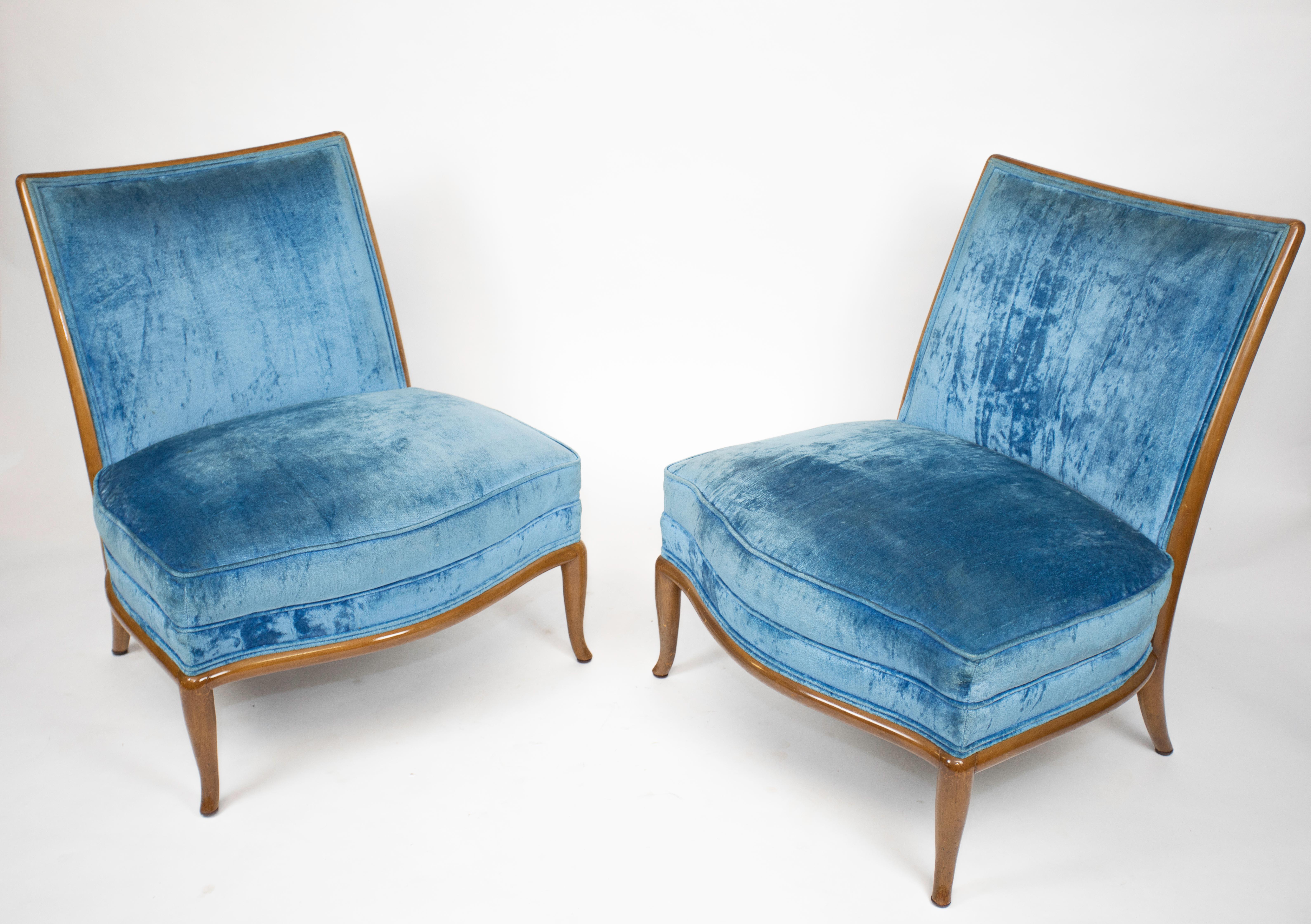 Pair of oversized Saber-legged lounge chairs by Robsjohn-Gibbings.
Reupholstered well (years ago).