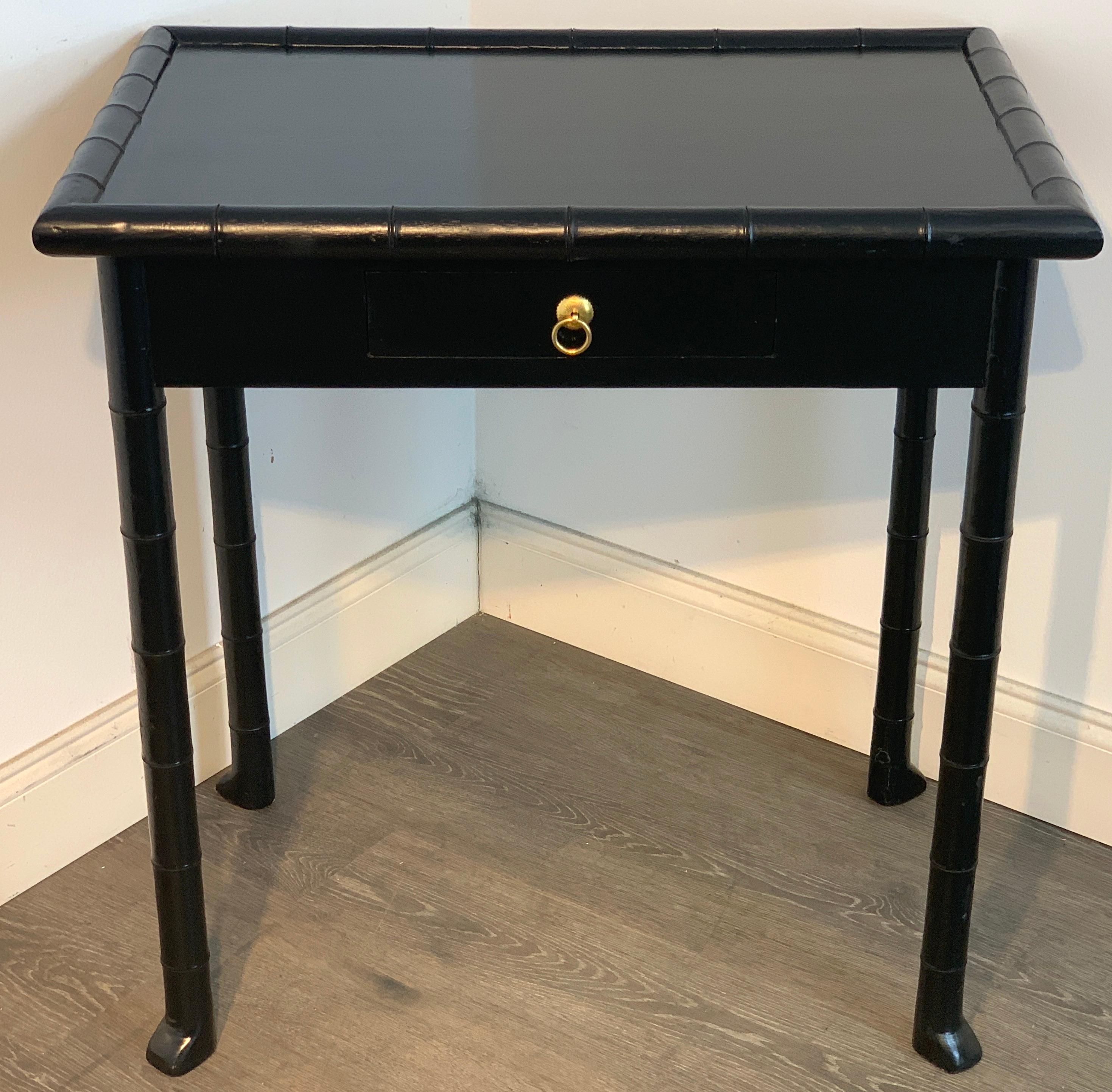 Robsjohn- Gibbings style black lacquered faux bamboo table, with inset top with surround of faux bamboo, fitted with one 11.75