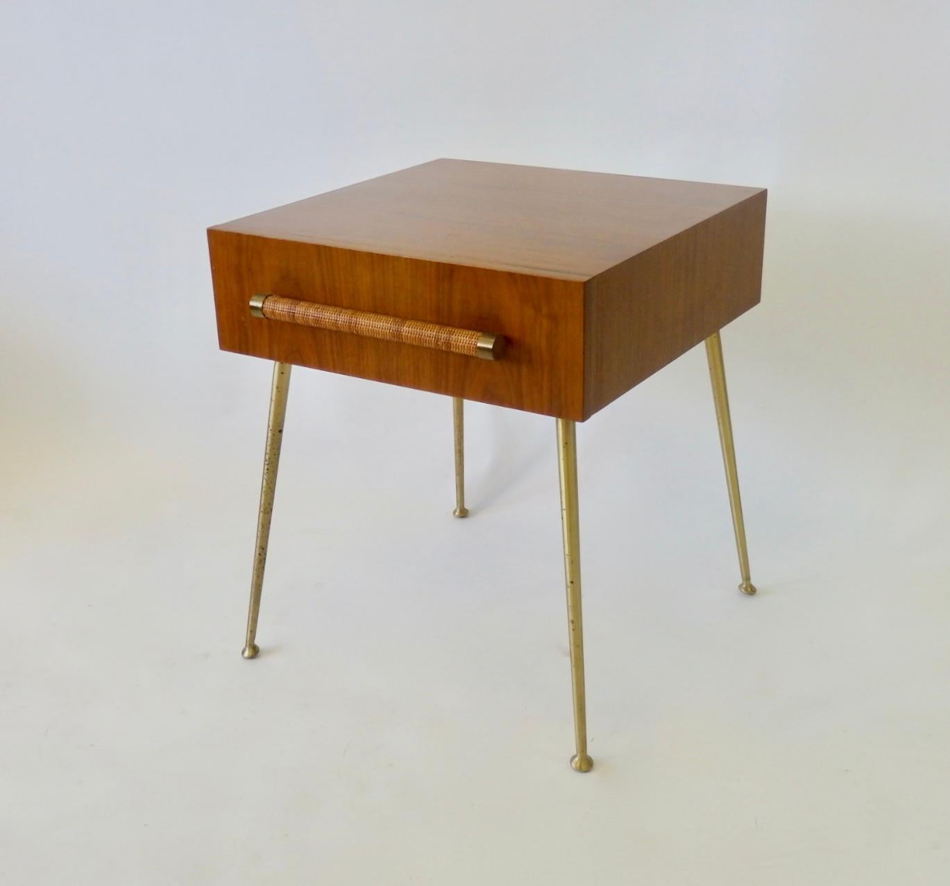 Nice original finish T.H. Robsjohn Gibbings for Widdicomb nightstand or side table. Raffia or cane covered drawer pull on brass tone legs. Tagged with Robsjohn Gibbings Widdicomb label. Date stamped 8/1956. I can offer reduced shipping with legs