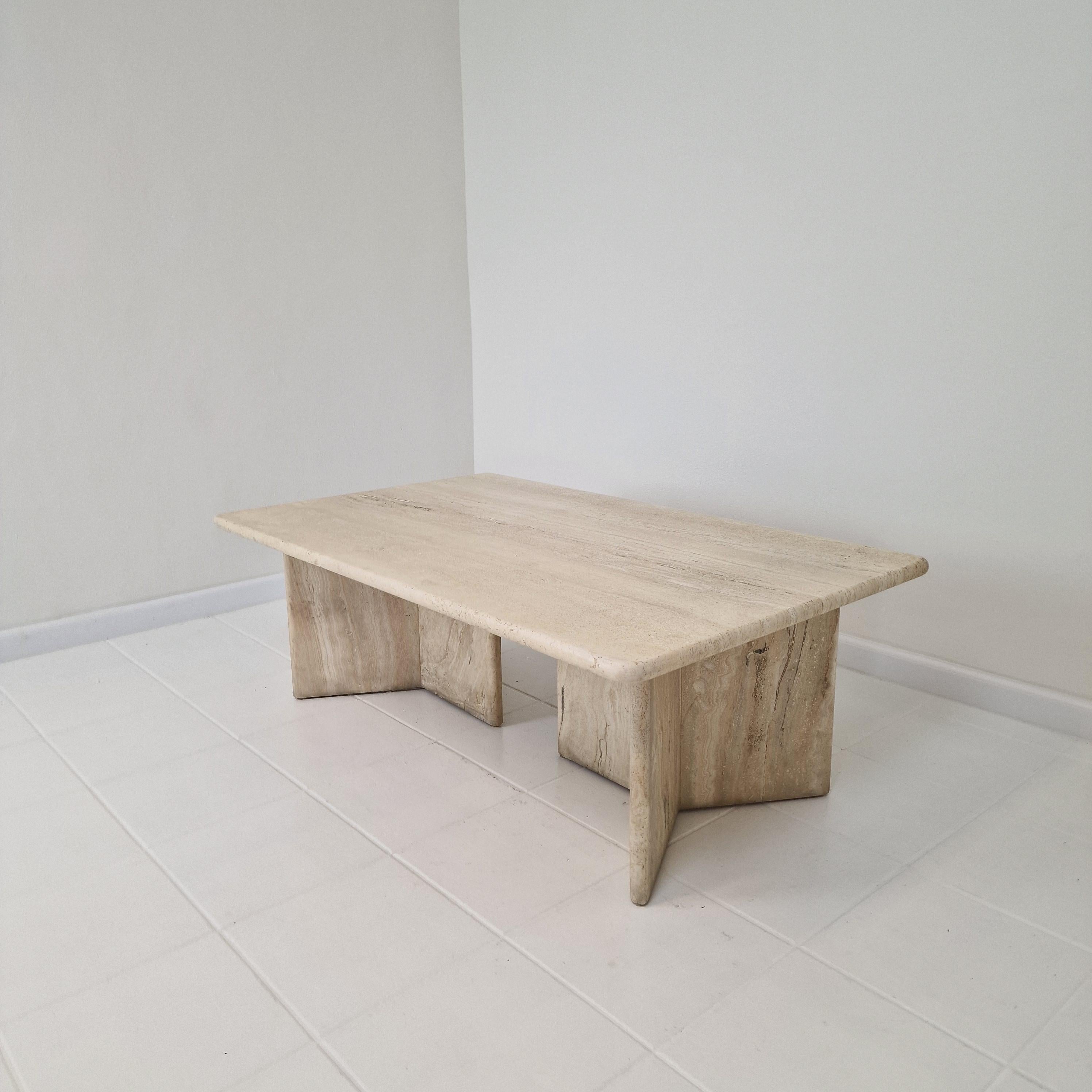 Stunning Italian coffee table handcrafted out of travertine, 1980's.

The beautiful rectangle top is rounded on the edge. 
This robust table is made of beautiful travertine.
Please take notice of the very nice patterns.

It has two very nice 3-point