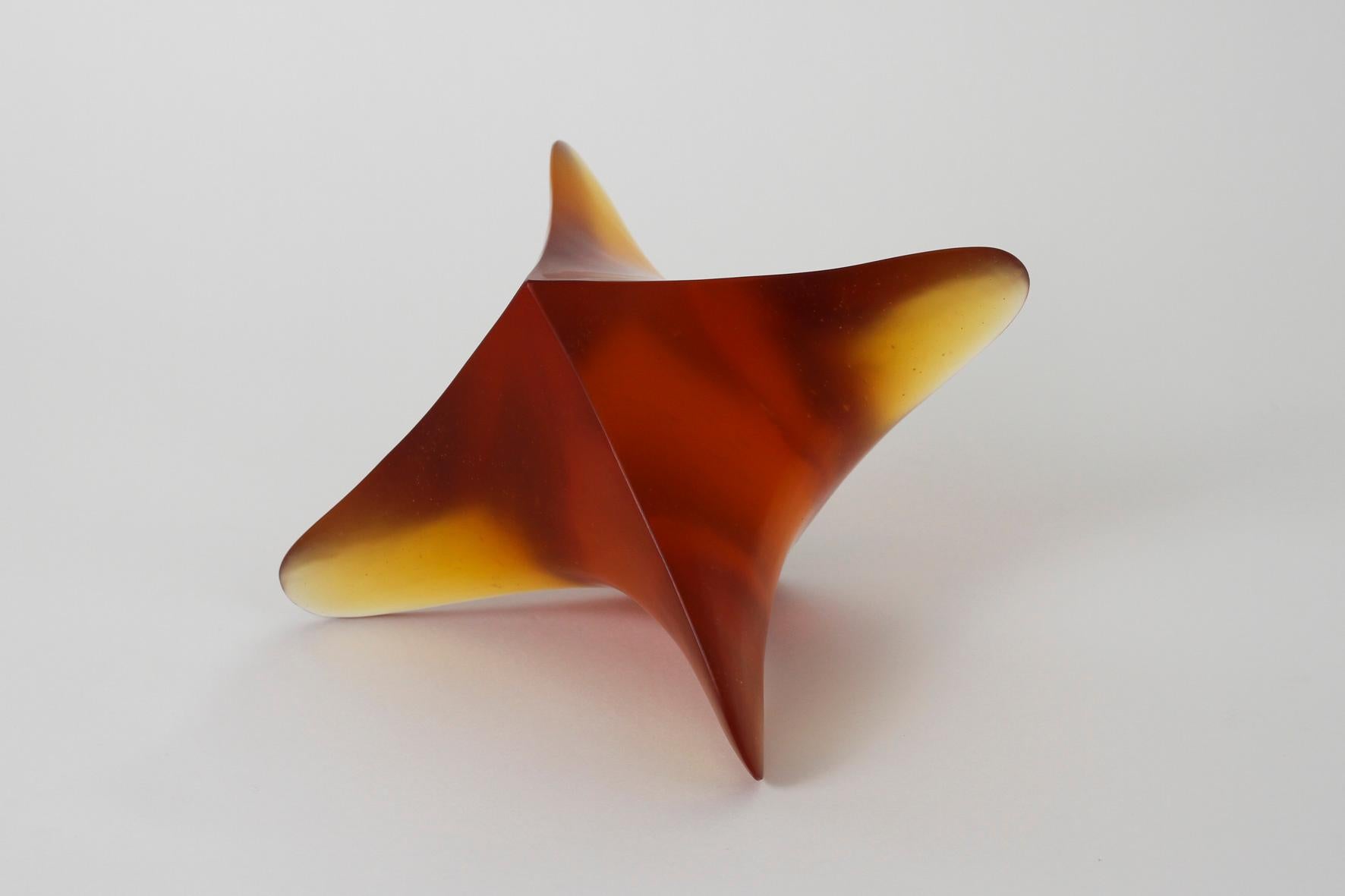 Whorl 1, contemporary cast glass sculpture in amber, by Robyn Campbell