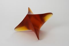 Whorl 1, contemporary cast glass sculpture in amber, by Robyn Campbell