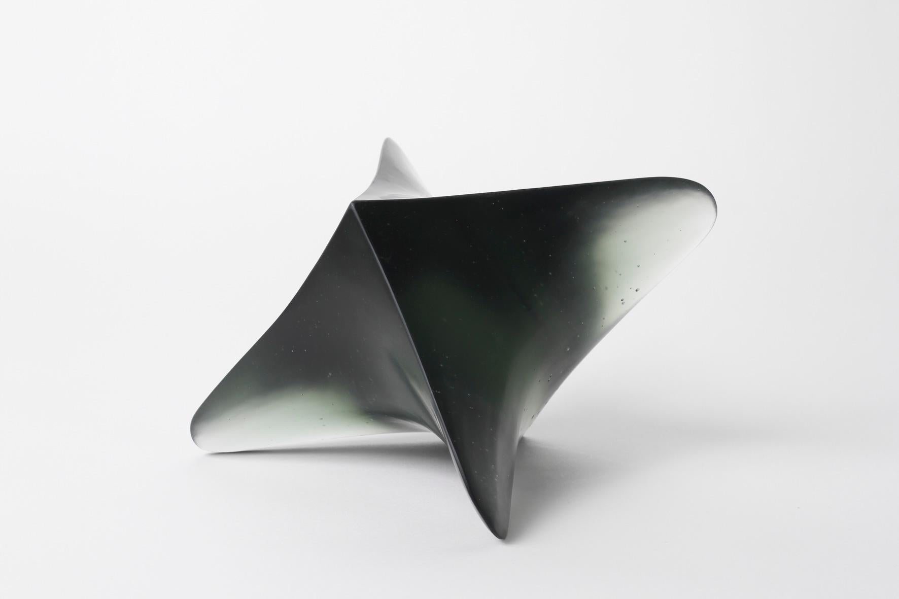 Whorl 4, cast & cut lead crystal glass, 11cm x 15cm x 14cm (d), 2023
Signed underneath.

Simplicity, line, material, surface, and form are the focus of Robyn Campbell’s art practice. She uses various mediums such as glass, ceramic, and drawing,