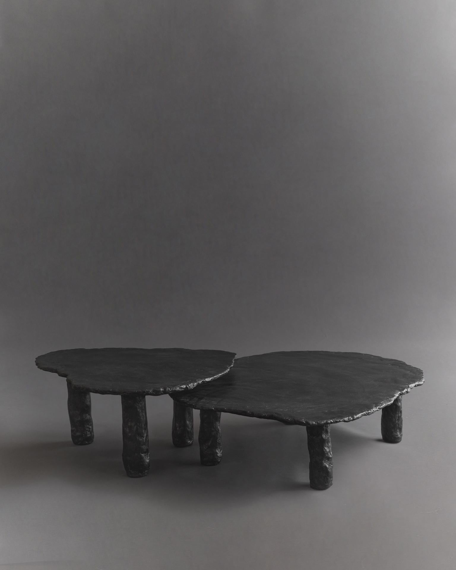 Inspired by stone slabs, this table embodies texture, organic shapes, and close attention to detail. Each product is handmade to order, resulting in slight variations to the one pictured. This makes each piece one of a kind. The tables are finished