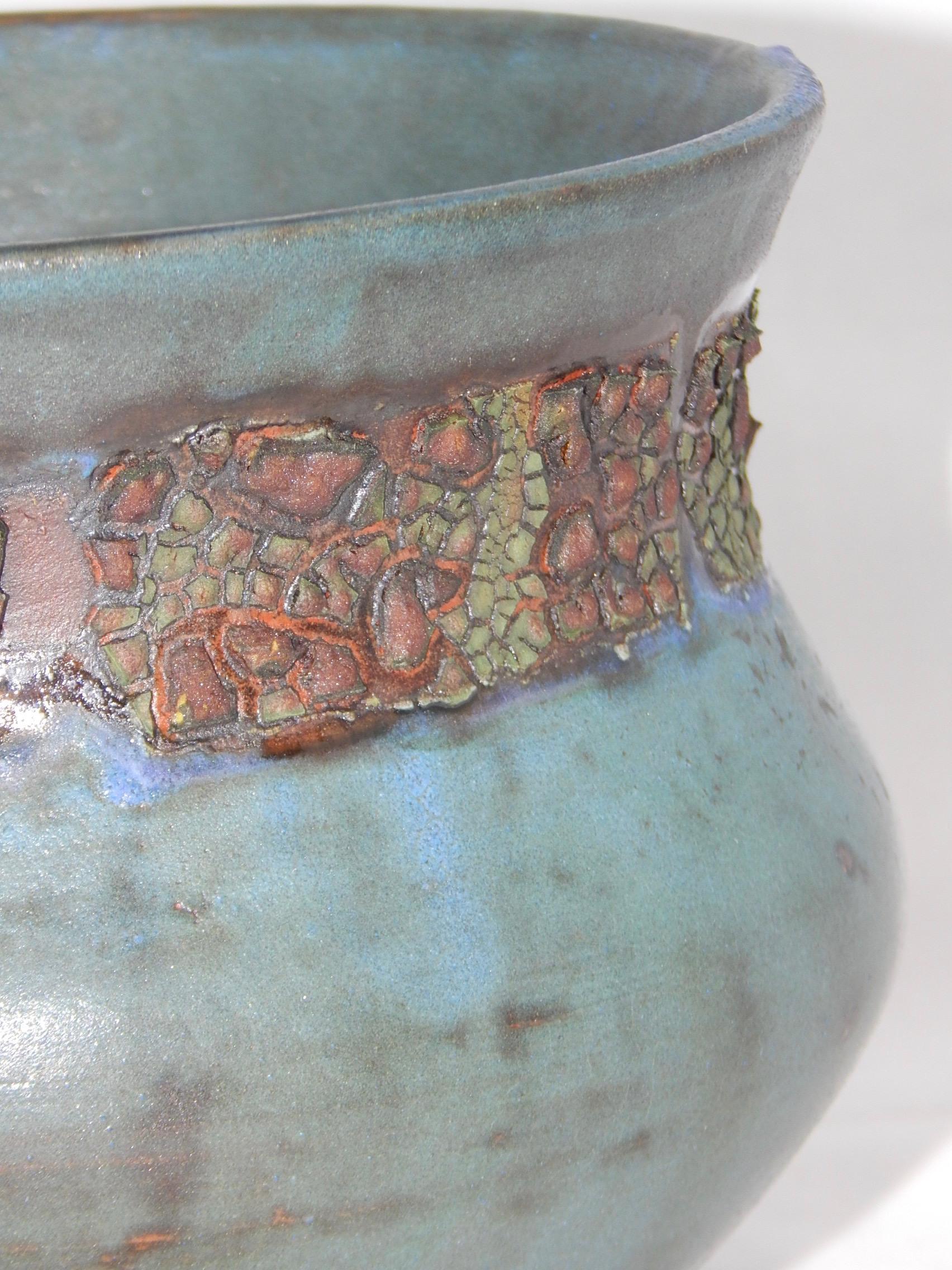 Rocann wheel thrown earthenware vessel by ceramicist Andrew Wilder.
This is a one of a kind object made in the ancient way- by hand in a small artisanal pottery. In this series Wilder explores the application of lichen under glazes to achieve