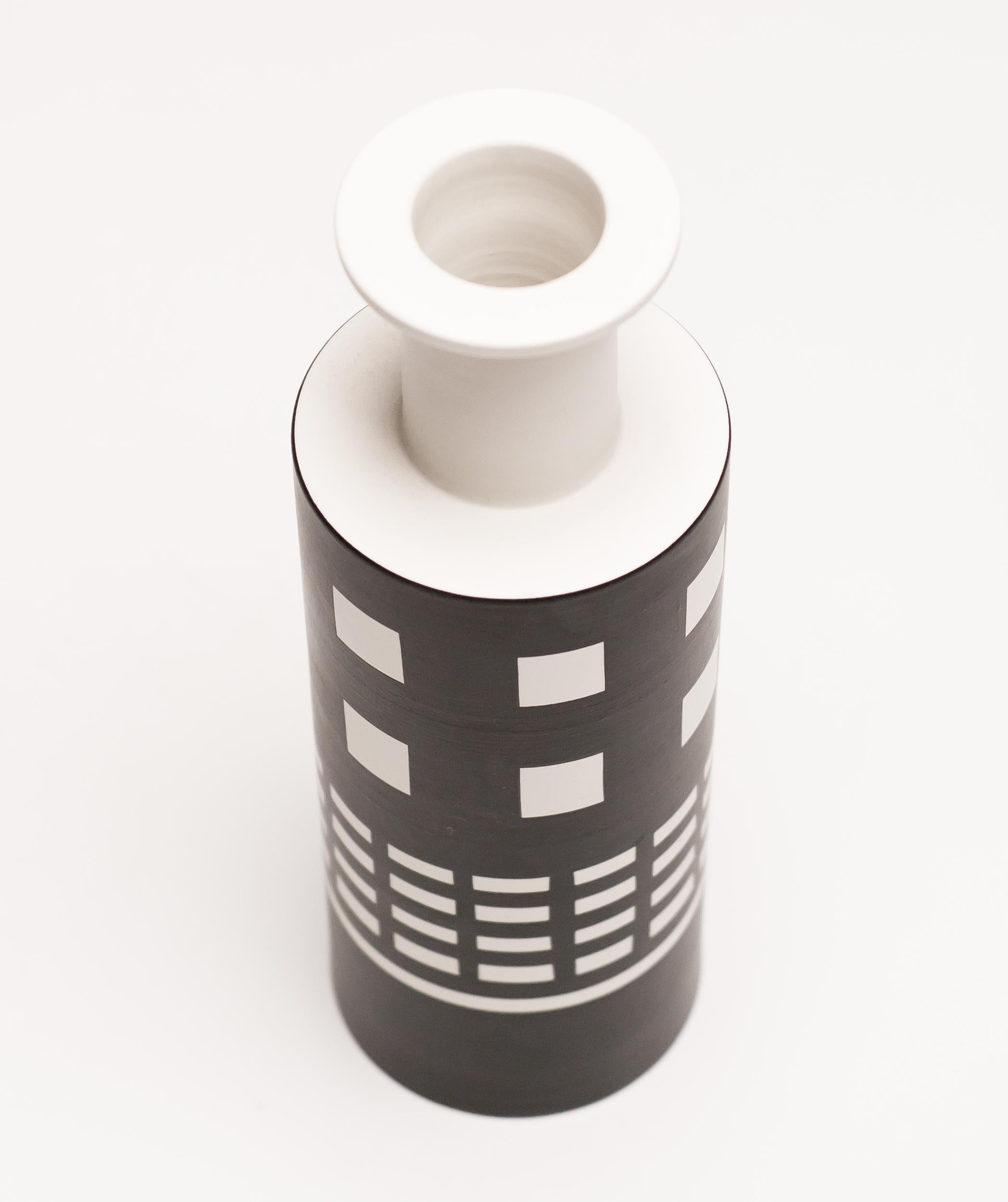 Rocchetto vase designed by Ettore Sottsass and made by Bitossi.
The Rocchetto was originally designed in 1959 and brought back in continuous re-editions, starting in 1982. 
This example was produced, circa 1999. Part of the Hollywood series of
