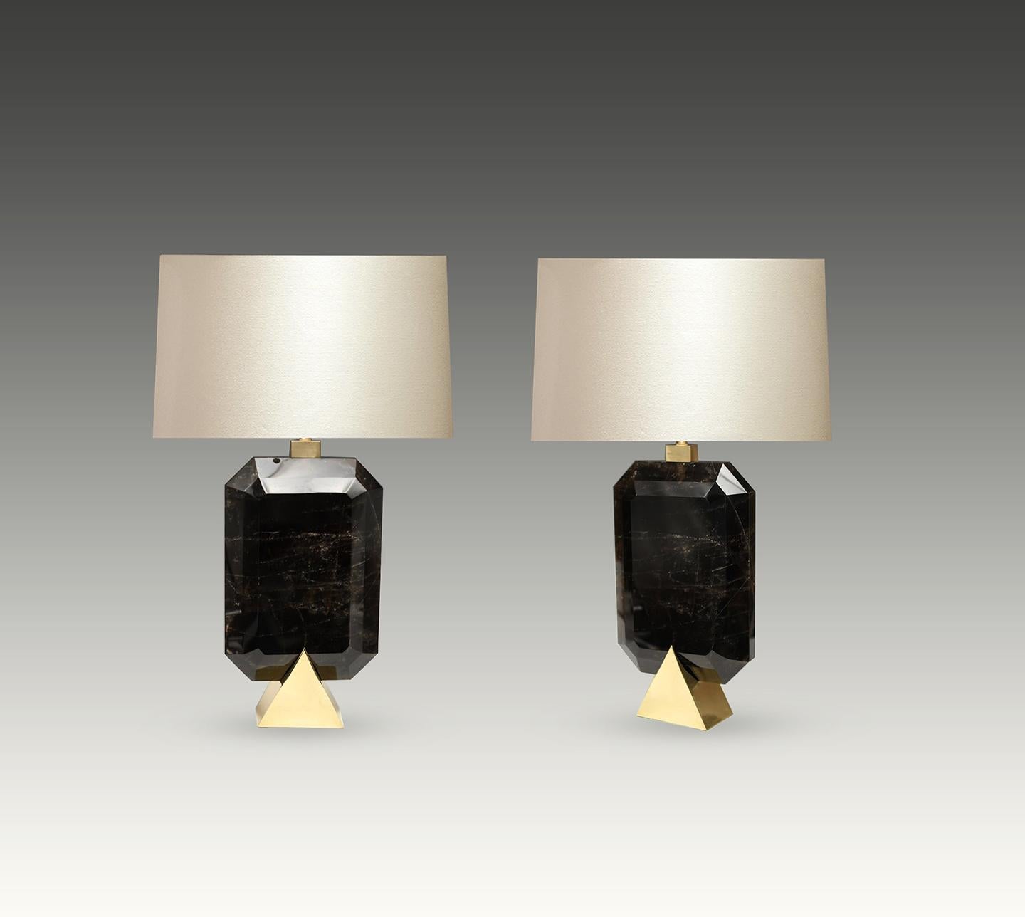 Pair of fine carved smoky rock crystal lamps with polished brass bases created by Phoenix Gallery. 

To the top of rock crystal height: 17 inch. 
(Lampshade not included).