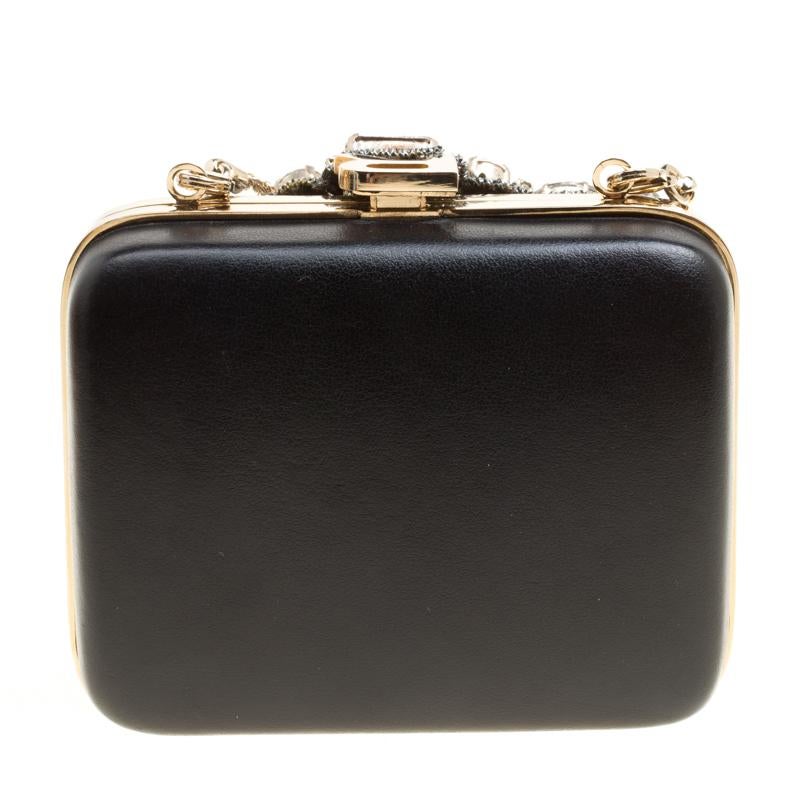 Crafted from leather, this Rochas clutch has a style that will catch glances from a mile. It has been designed with an R on the top frame, a chain, and a leather interior. You can choose between the smooth black leather side or one with crystal