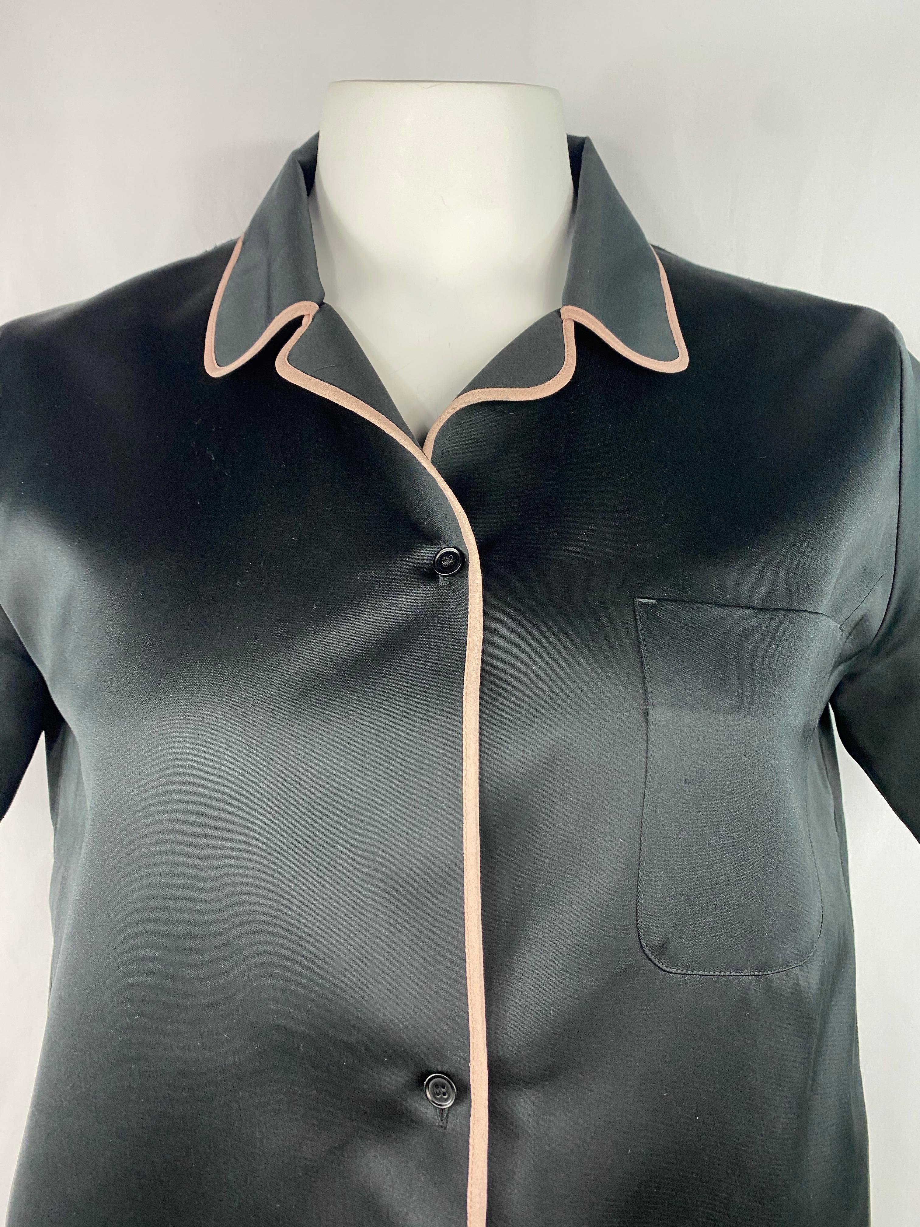 Product details:

The shirt features cream/ peach/ light pink trimming, collar, three front buttons closure and side pocket detail.
Made in Italy.