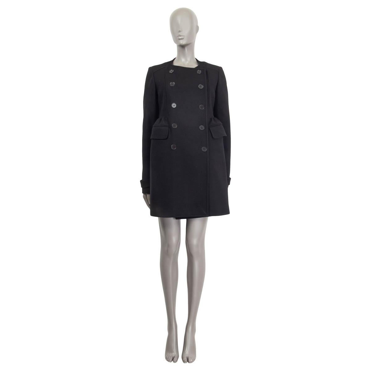 100% authentic Rochas collarless peacoat in black virgin wool (75%), nylon (15%), and cashmere (10%). With bell-shaped gathered waist, pleated back, two flap pockets on the sides, and buttoned cuff straps. Closes with black buttons on the front.