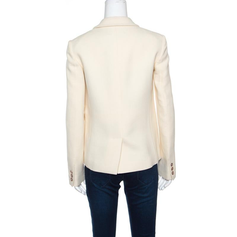 Its won our hearts and will yours too for this cream Rochas blazer is all about elegance and feminity! It is made of a blend of fabrics and features a chic and sharp silhouette. It flaunts notched lapels with artistic eye motifs that are embellished