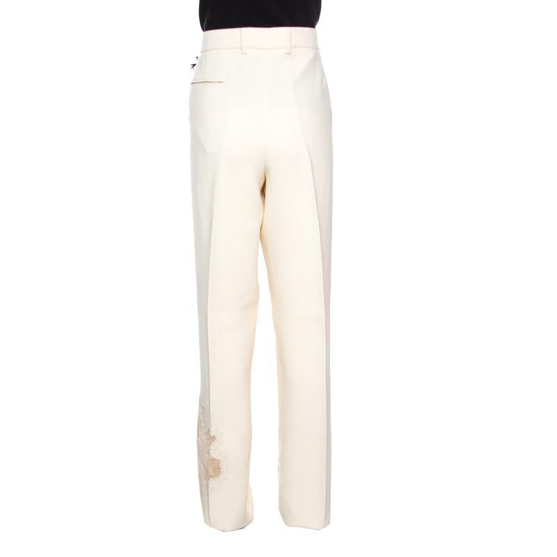 These trousers from Rochas are well-tailored and high on style. It is made of quality fabrics and comes flaunting a mesh floral embroidery on one of the legs. The trousers will give you a fabulous fit when you wear it with a simple blouse and