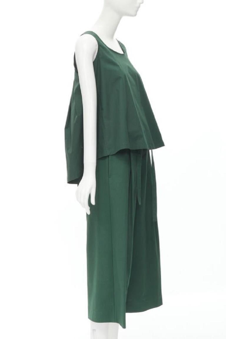ROCHAS dark green cotton blend flared back vest wide leg pants FR38 S
Reference: LNKO/A01887
Brand: Rochas
Material: Cotton, Blend
Color: Green
Pattern: Solid
Extra Details: Pleated flared back high low hem voluminous top. Self tie belt wide leg