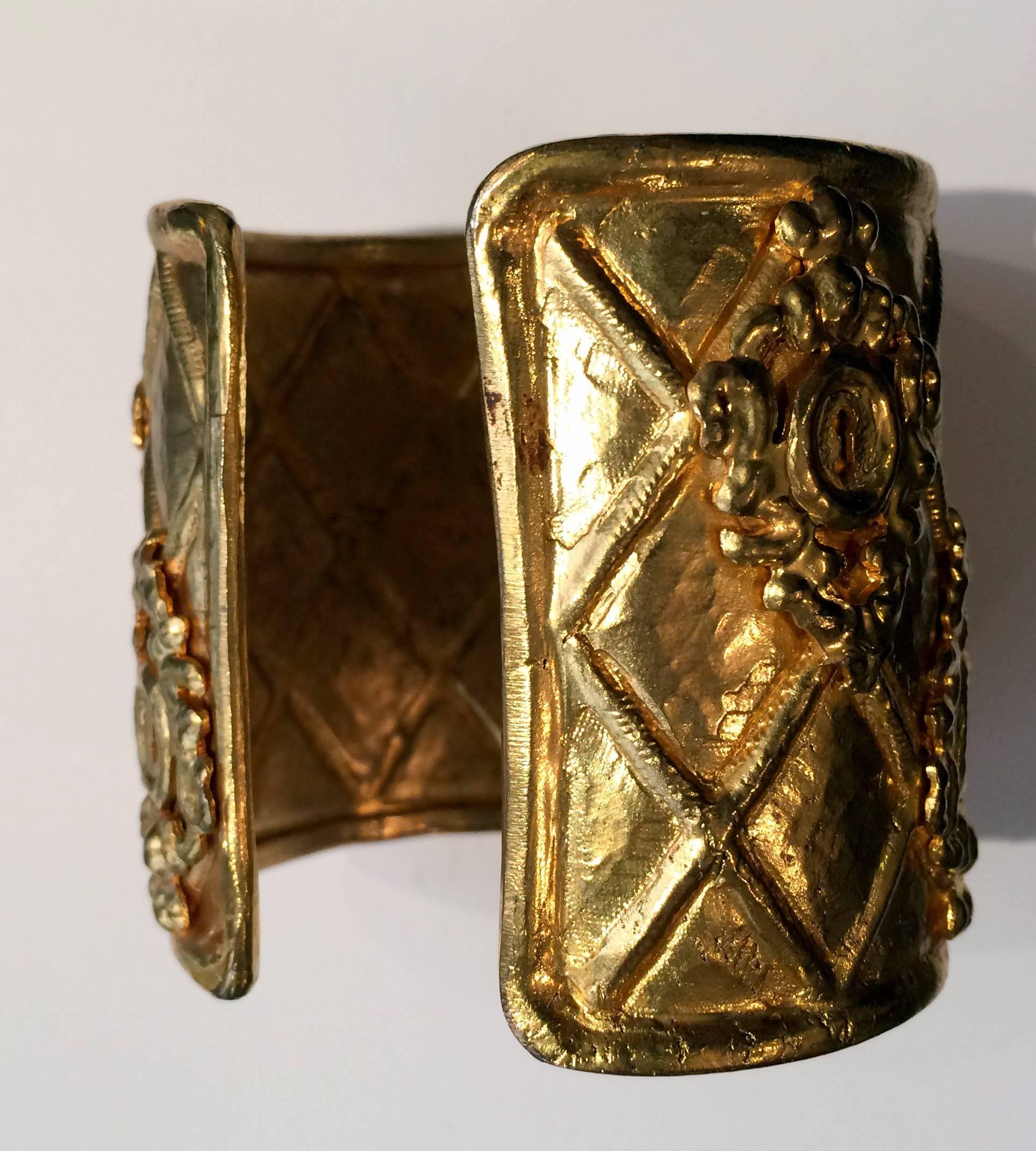 1980s Rochas gold tone large cuff bracelet featuring a delicate work.
Height:2,3in. (6cm)  Diameter:2,7in (7cm)
In excellent vintage condition. Made in France.
We guarantee you will receive this gorgeous item as described and showed on photos.

