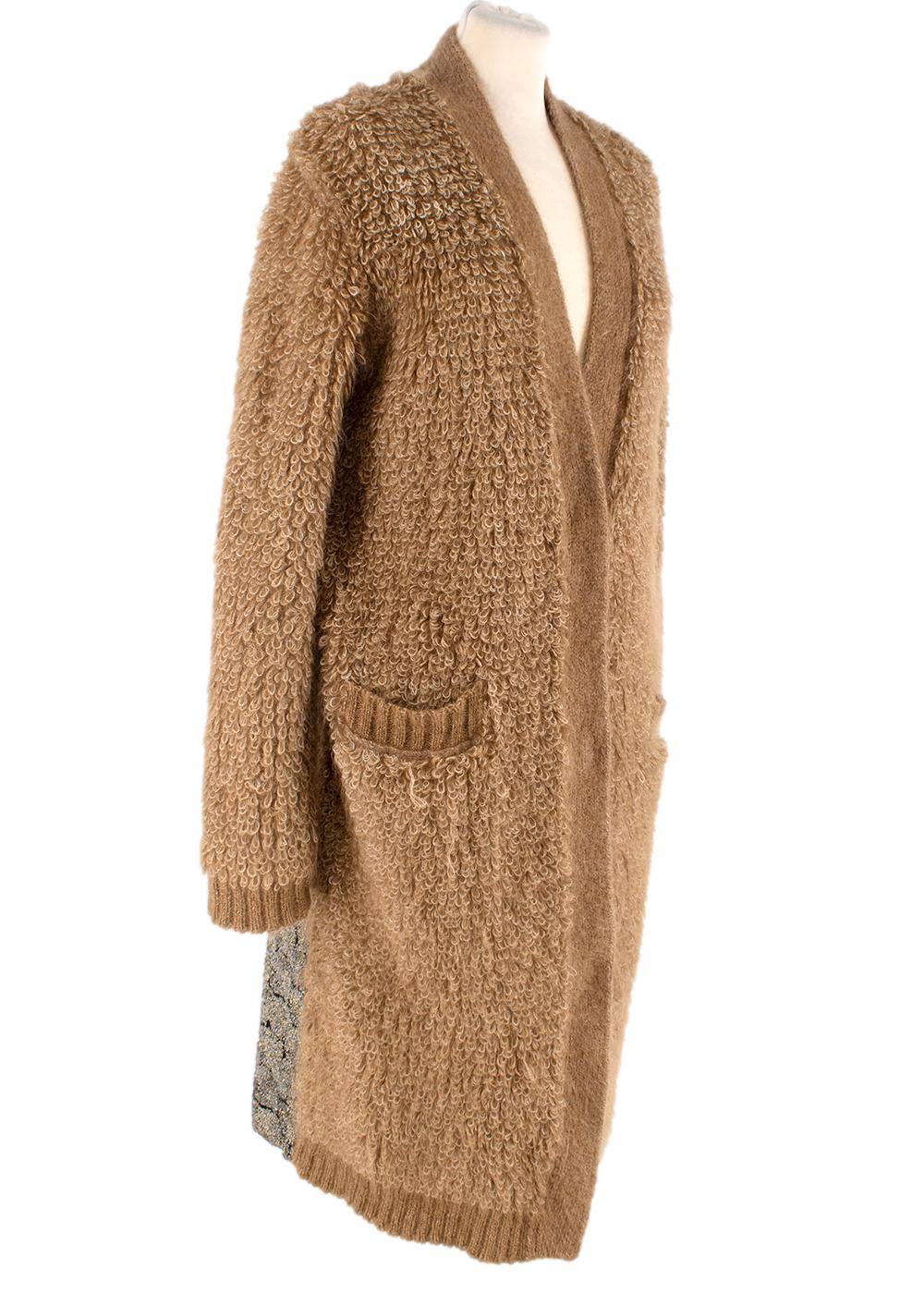 Rochas Mohair Blend Contrast Jacquard Back Knit Coat

-This knitted mohair coat features two patch pockets 
-Shawl lapel 
-concealed button closure 
-The back features a contrasting metallic jacquard panel that really brings the coat alive.
-A