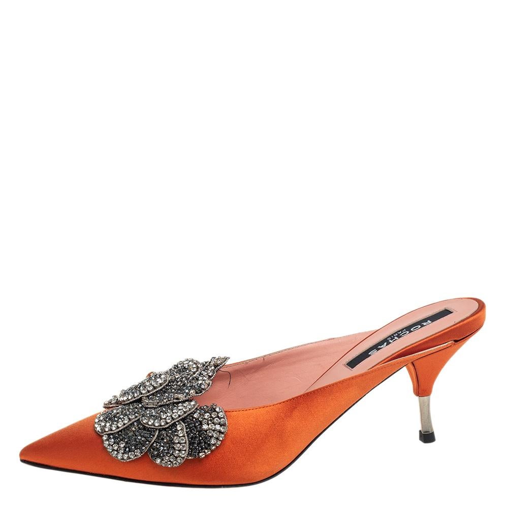 These glamorous mule sandals from Rochas will make sure you look absolutely fabulous. They are finely crafted from satin in orange and feature a pointed-toe silhouette. They flaunt exquisite crystal embellishments on the vamps and come equipped with