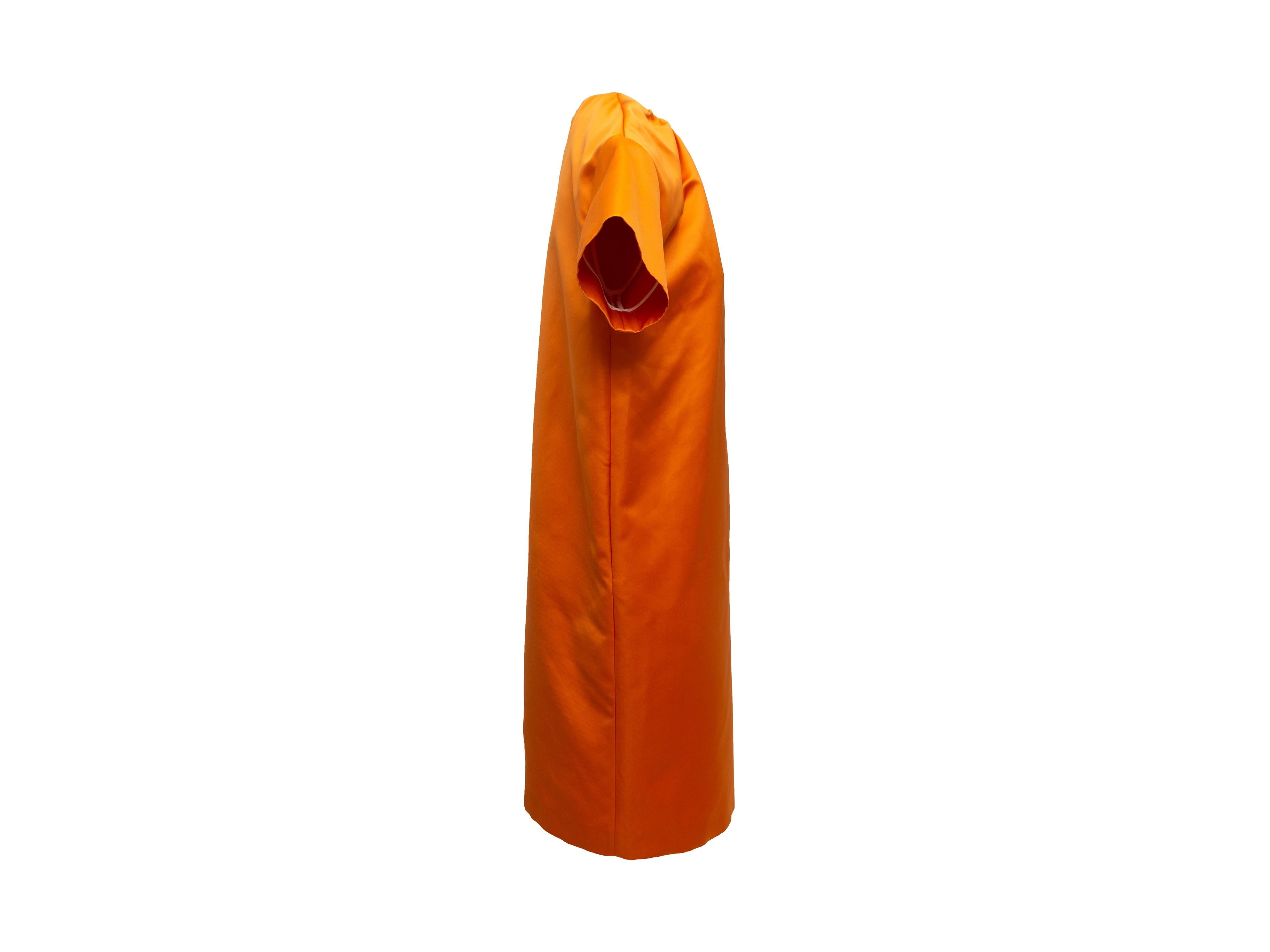 Product details: Orange short sleeve shift dress by Rochas. Crew neck. Zip closure at nape. Designer size 40. 41
