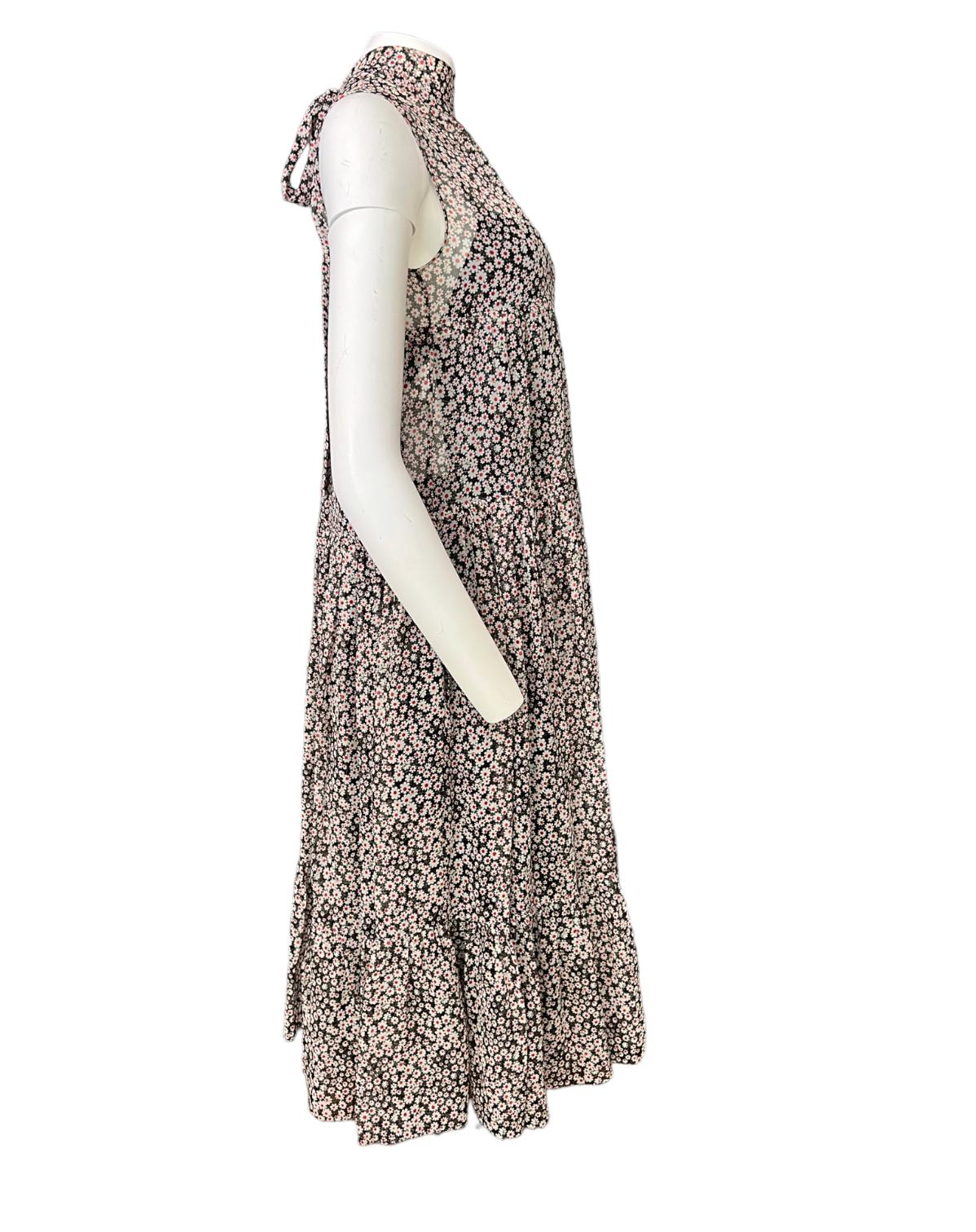 - Turtle neck
- Rear bow detail
- See through fabric
- Floral pattern
- Sleeveless
- Comes with black under dress
- Made in Italy 

