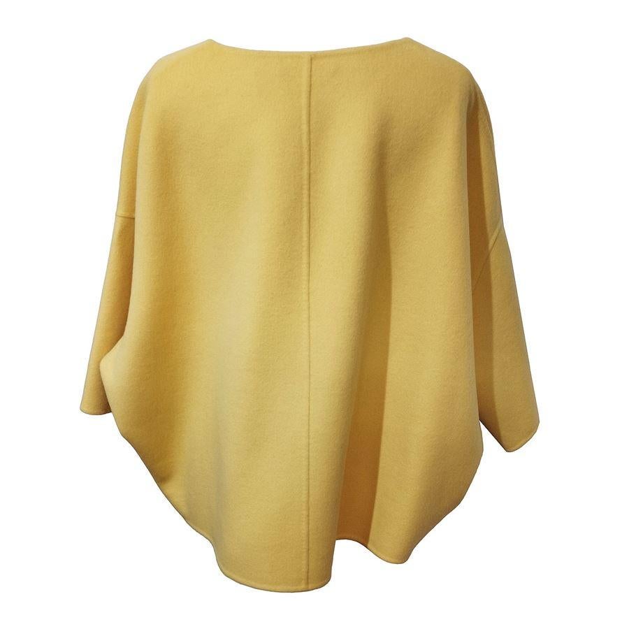 Wool (80%) and angora Yellow color Short sleeve Shoulder/hem lenght cm 55 (21,65 inches)