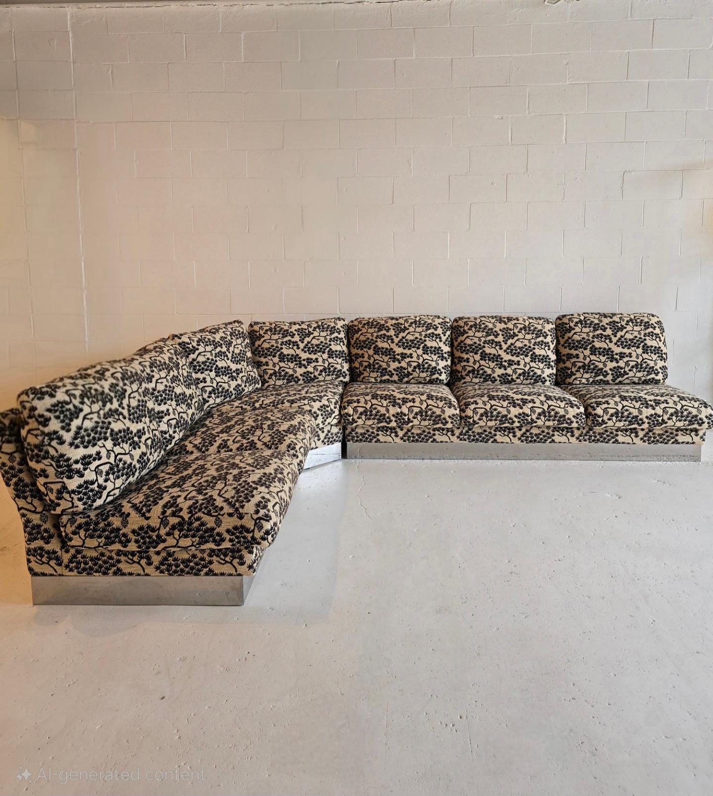 Spectacular sectional sofa by Roche Bobois (tagged). Made in France by custom order in the 1980s. The original fabric is incredible and unique. The aluminum base perfectly compliments the intricate fabric. The cushions are down filled. It features