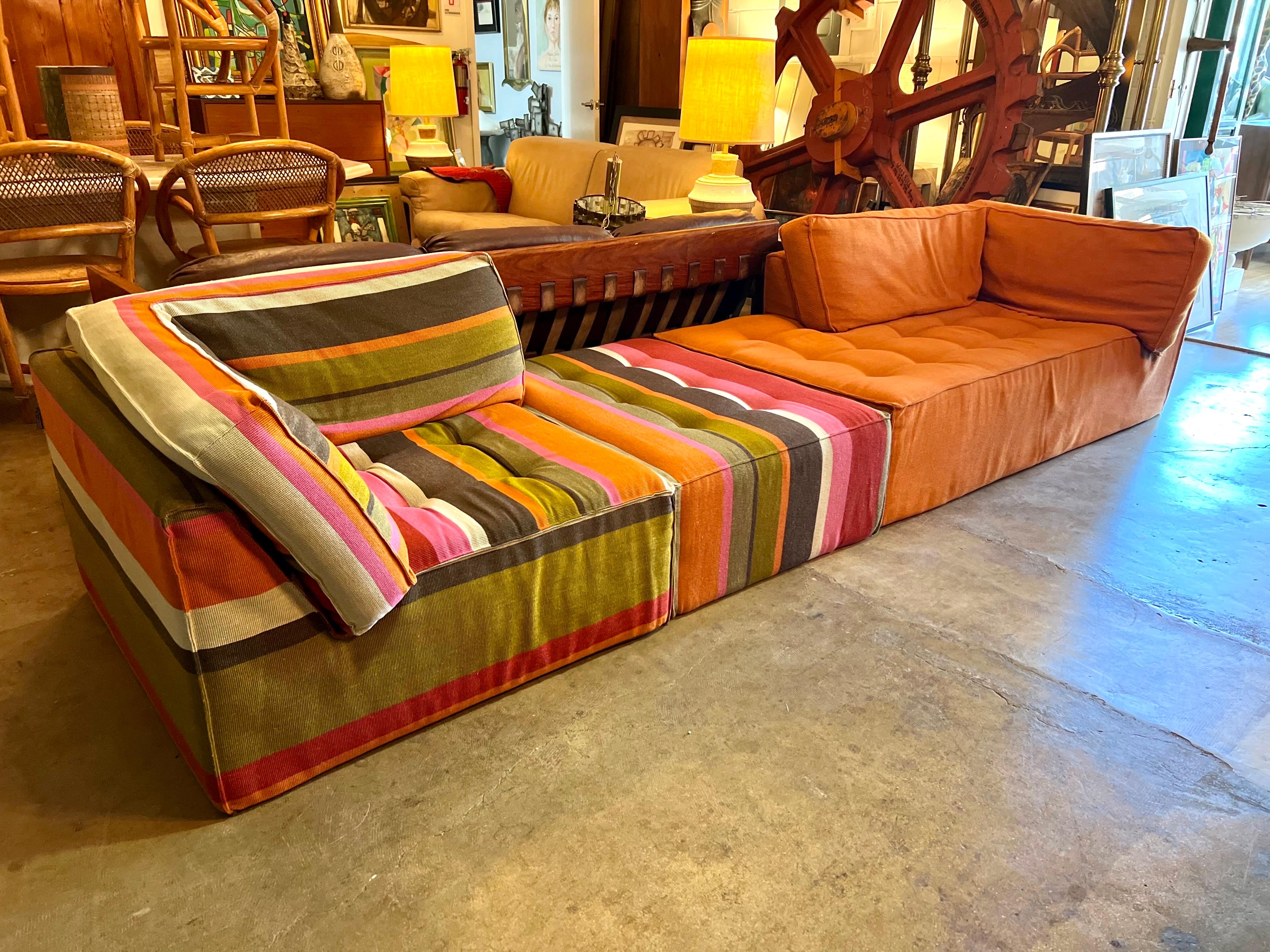 3-piece Roche Bobois modular sectional lounge set features two-armed seating sections and an ottoman. The Mah Jong style allows you to position the seating in a variety of ways. Fabric is in great condition. Not quite sure about the year; the fabric