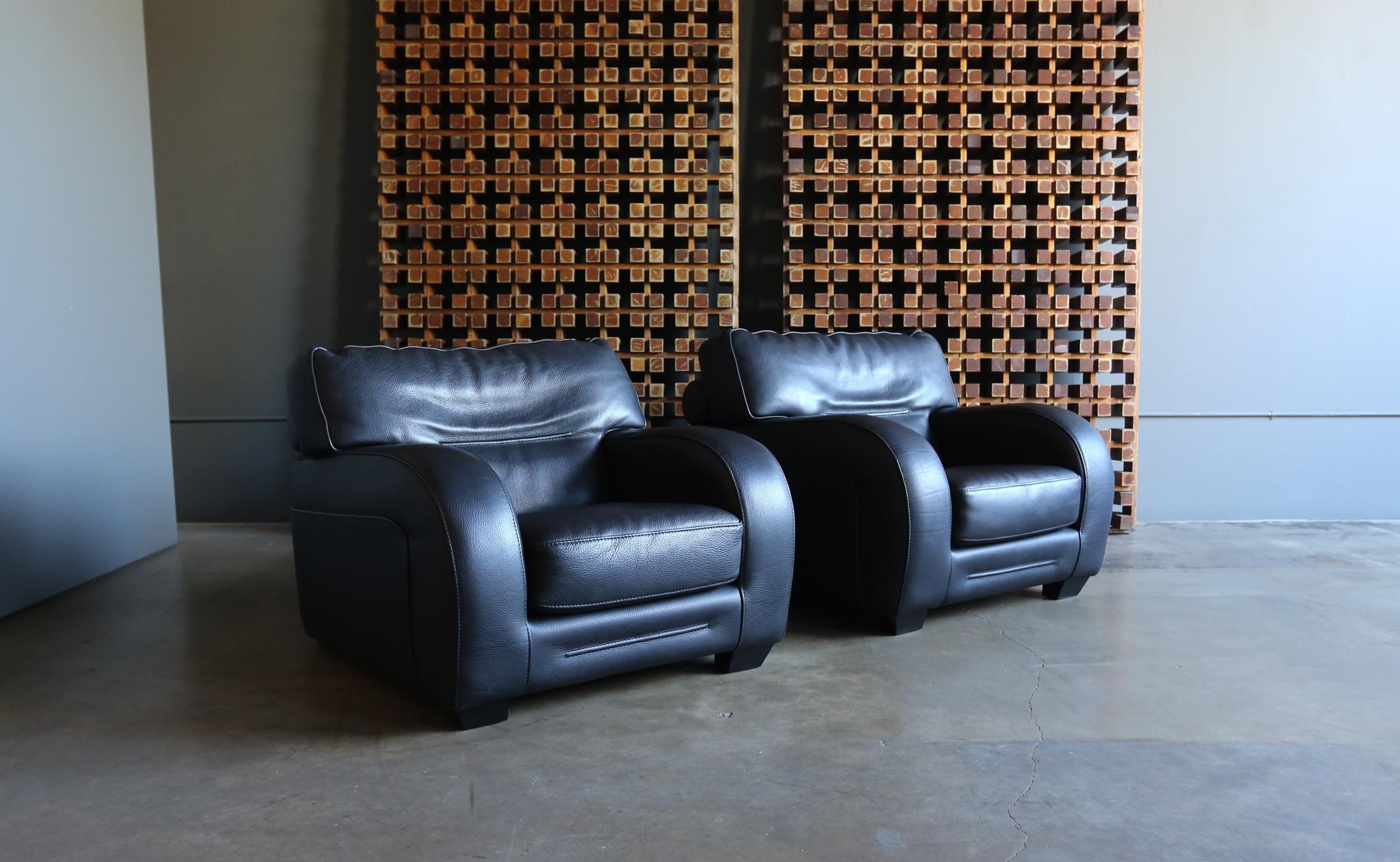 Roche Bobois black pebble leather lounge chairs. circa 1990.