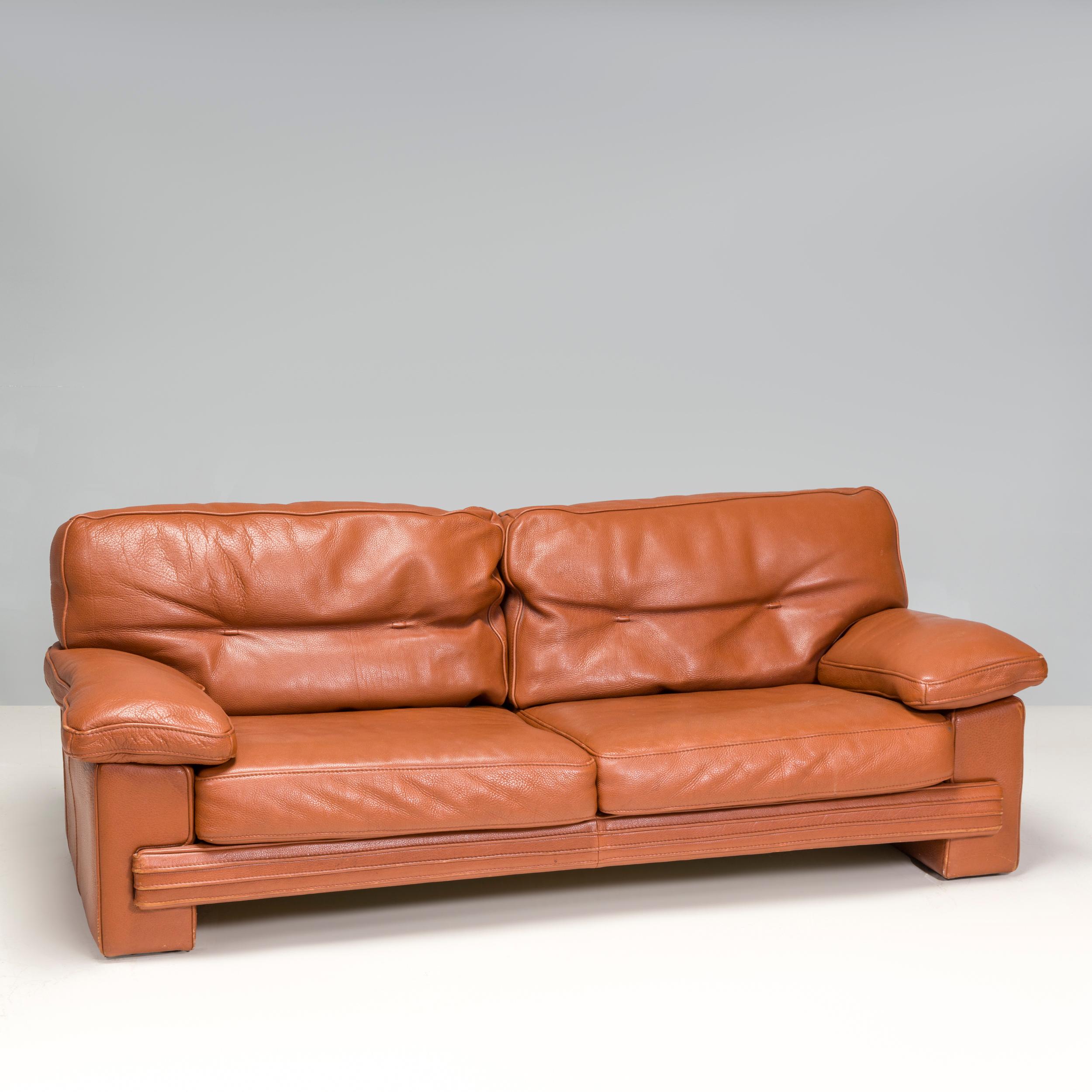 Designed and manufactured by Roche Bobois, this sofa is the perfect balance of comfort and style. The two seat cushions, two back cushions and two arm cushions are upholstered in leather. The sofa could fit a variety of interior aesthetics; the