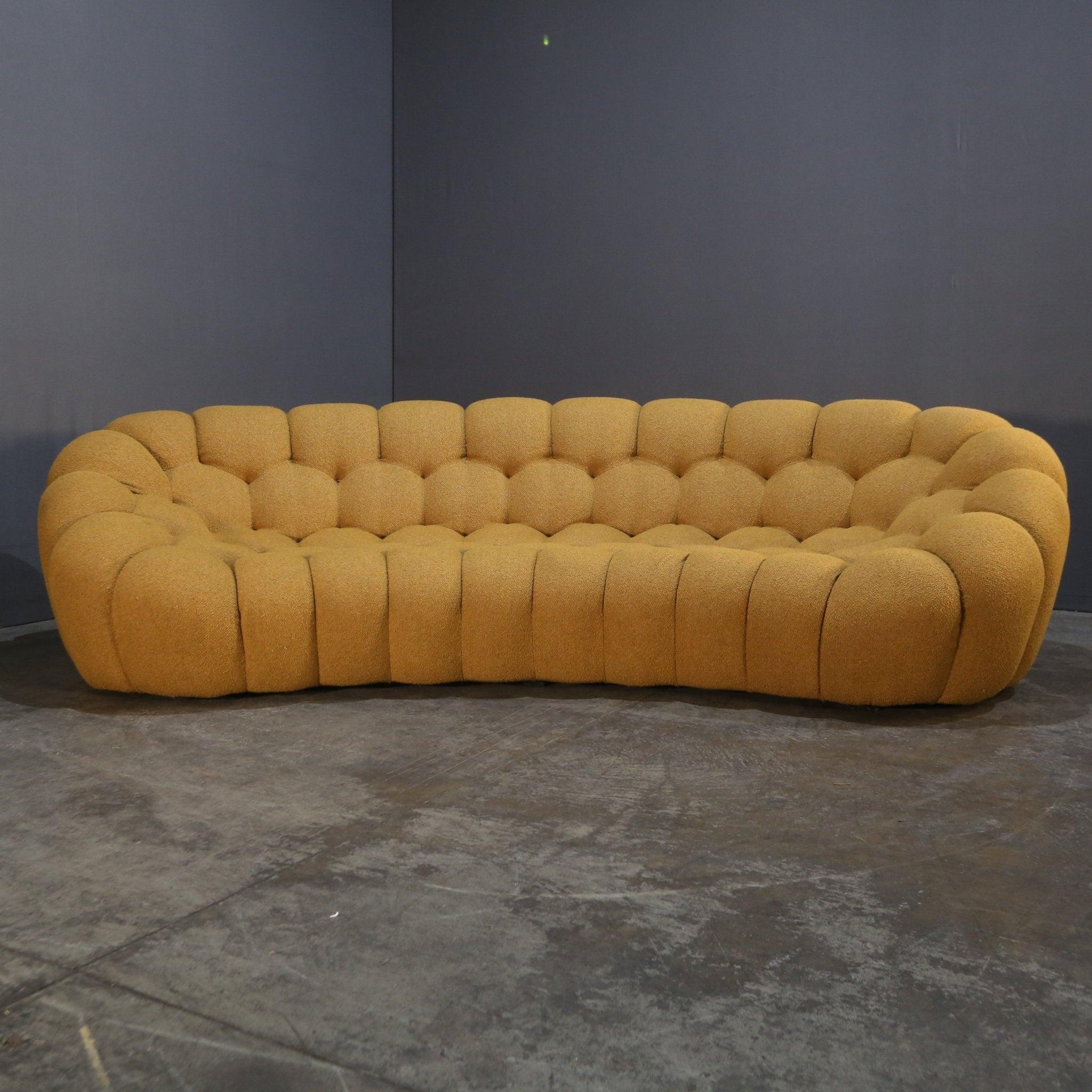 Introducing the stunning Bubble Curved Sofa by Roche Bobois, a luxurious addition to any living space. Crafted with the highest quality materials, this sofa boasts a unique curved design that exudes elegance and sophistication, whilst the plush