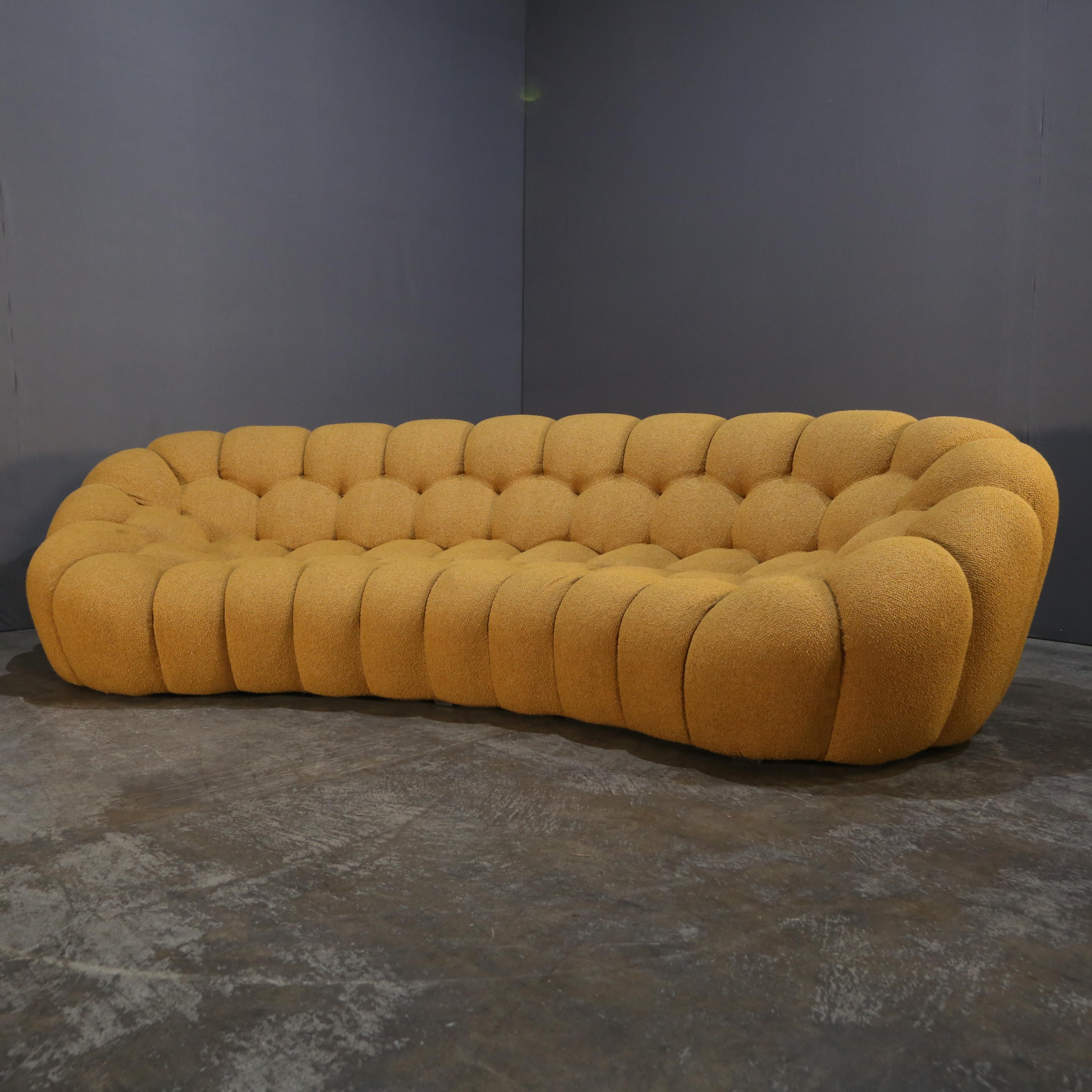 Introducing the stunning Bubble Curved Sofa by Roche Bobois, a luxurious addition to any living space. Crafted with the highest quality materials, this sofa boasts a unique curved design that exudes elegance and sophistication, whilst the plush
