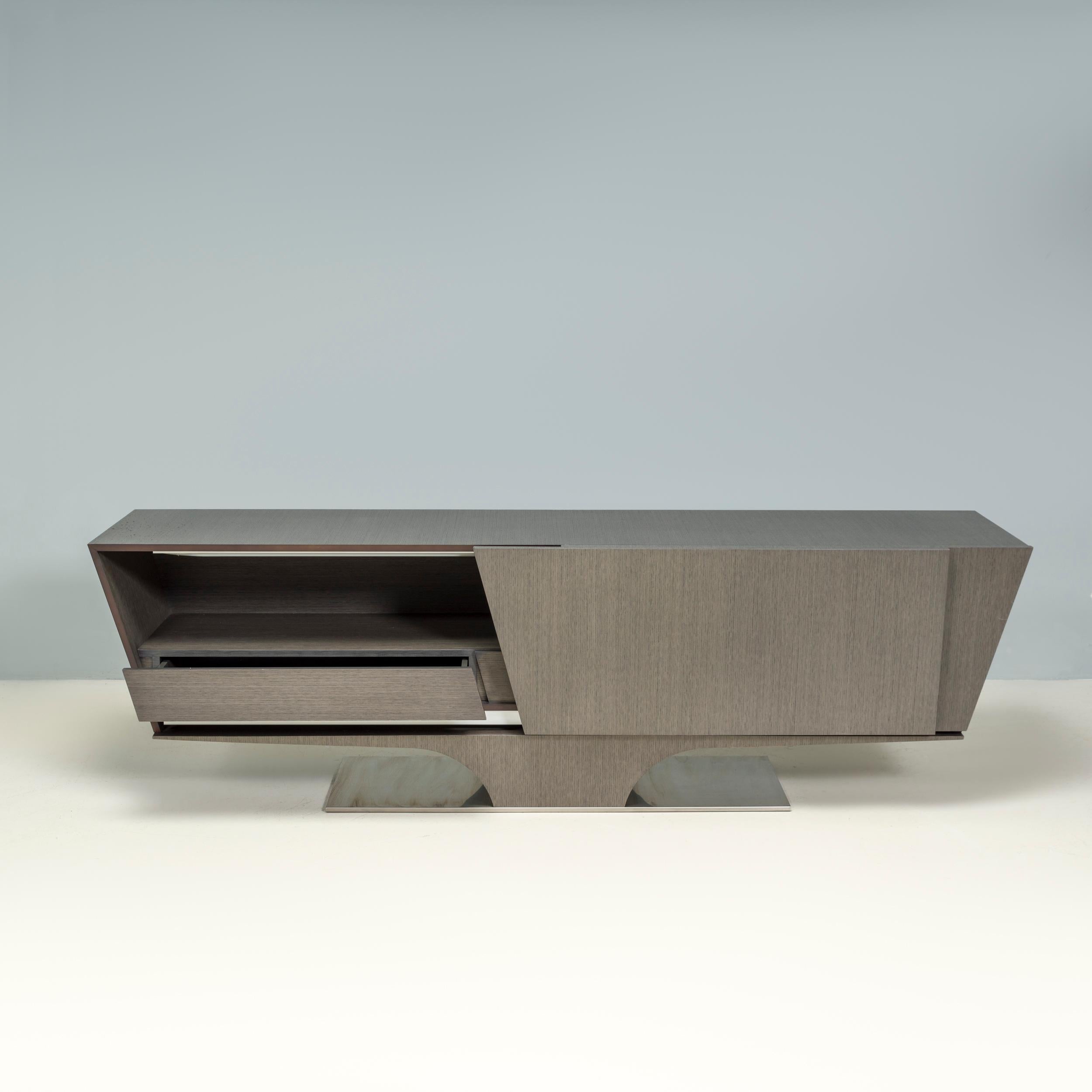 Originally designed in 2006 by Daniel Rhode for Roche Bobois, the Vertigo collection has a sleek, modern aesthetic.

The buffet is constructed from a wood laminate with an angled silhouette, which allows for a generous sideboard area and tapering