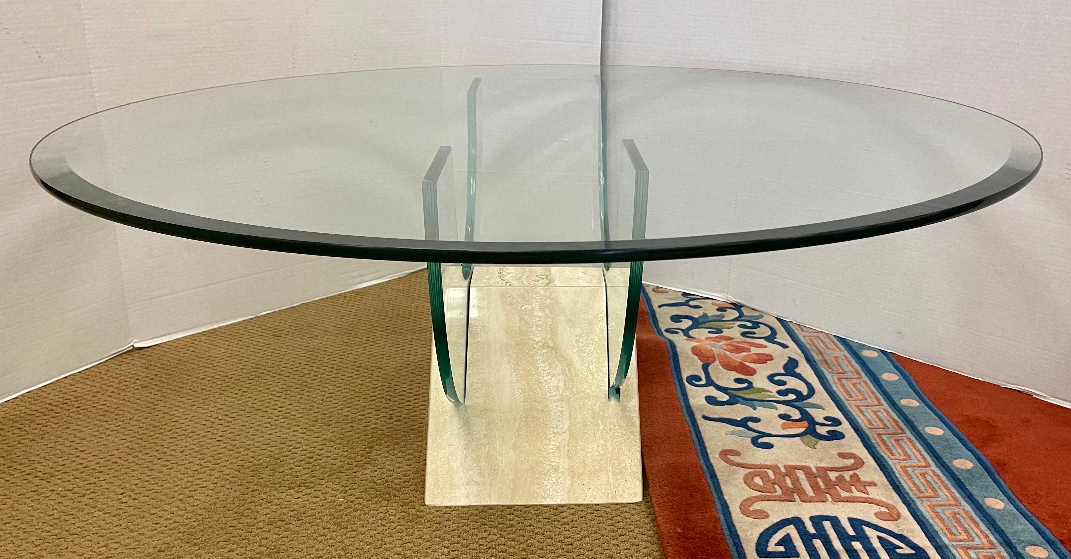 Magnificent, made in Italy (with hallmark on bottom) post modern round glass and carrara marble cocktail table. There are two pieces of slotted glass that fit into a luxurious sculpted piece of carrara marble that form the base and the 42