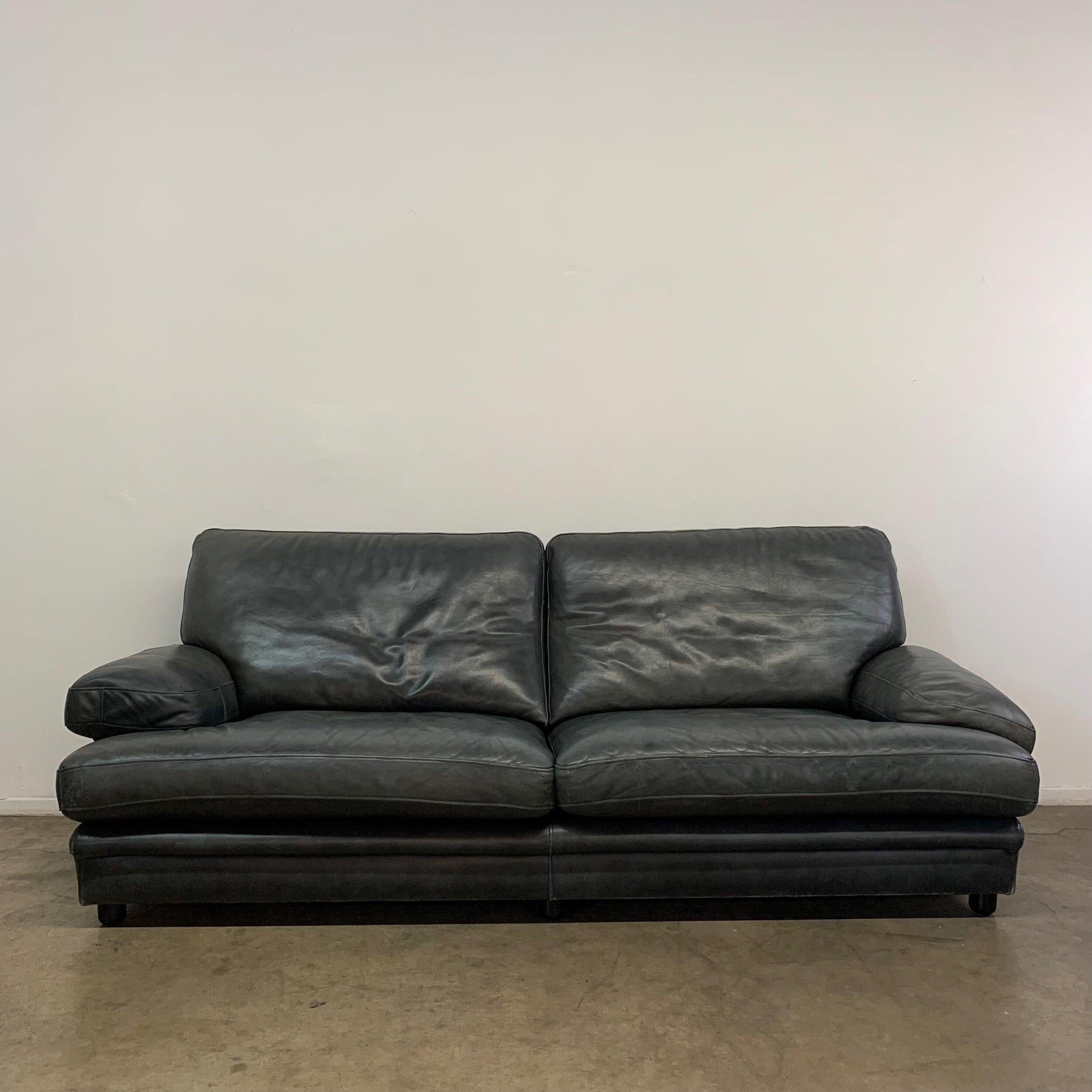 W87 D38.5 H34

SW62 SD20 AH4 SH16.25

Distressed black leather feather down sofa by Roche Bobois. Leather has no rips or tears and leather is thick and in well preserved condition.