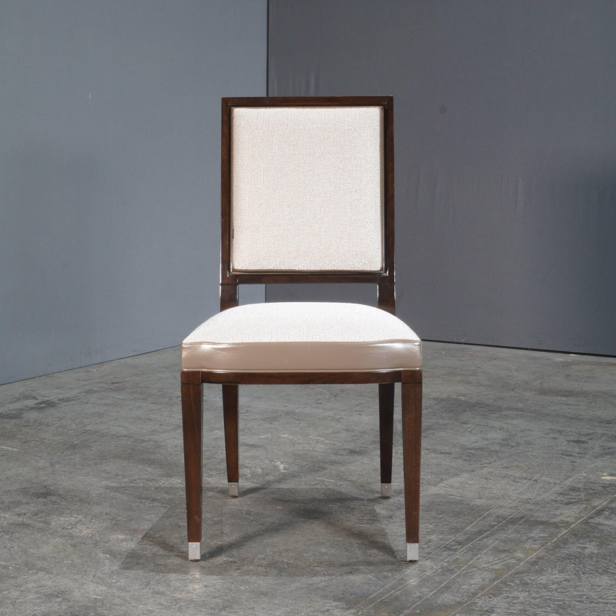 The Grand Hotel Dining Chair by Roche Bobois, designed by Pierre Dubois & Aimé Cécil, epitomises refined elegance and timeless style. Crafted with a harmonious blend of luxurious materials, this chair features a solid wood frame that exudes