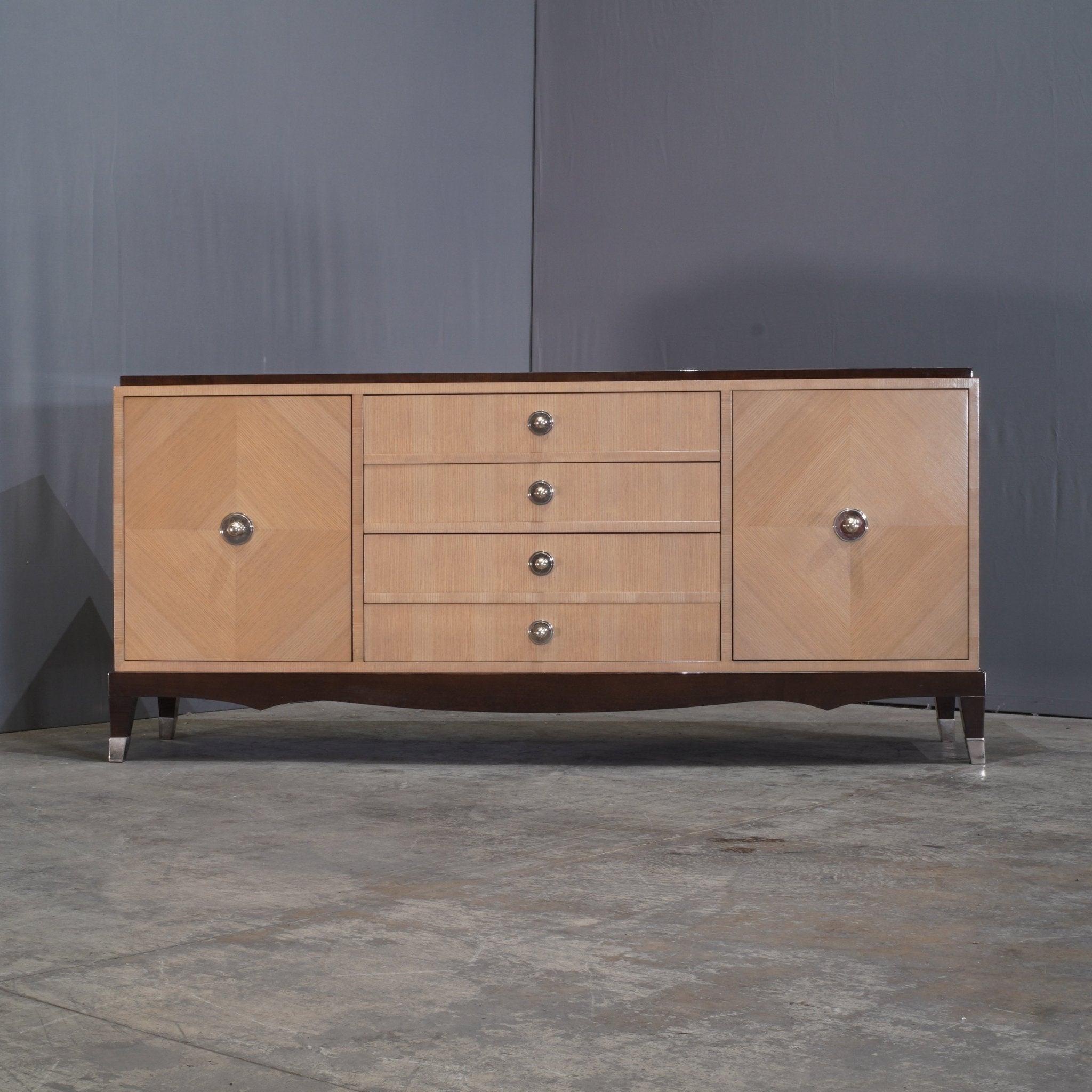 Elevate your interior with the Grand Hotel Sideboard by Roche Bobois, a creation by the visionary designers Pierre Dubois & Aimé Cécil. This sideboard is a celebration of sophisticated design and masterful craftsmanship, featuring a striking blend