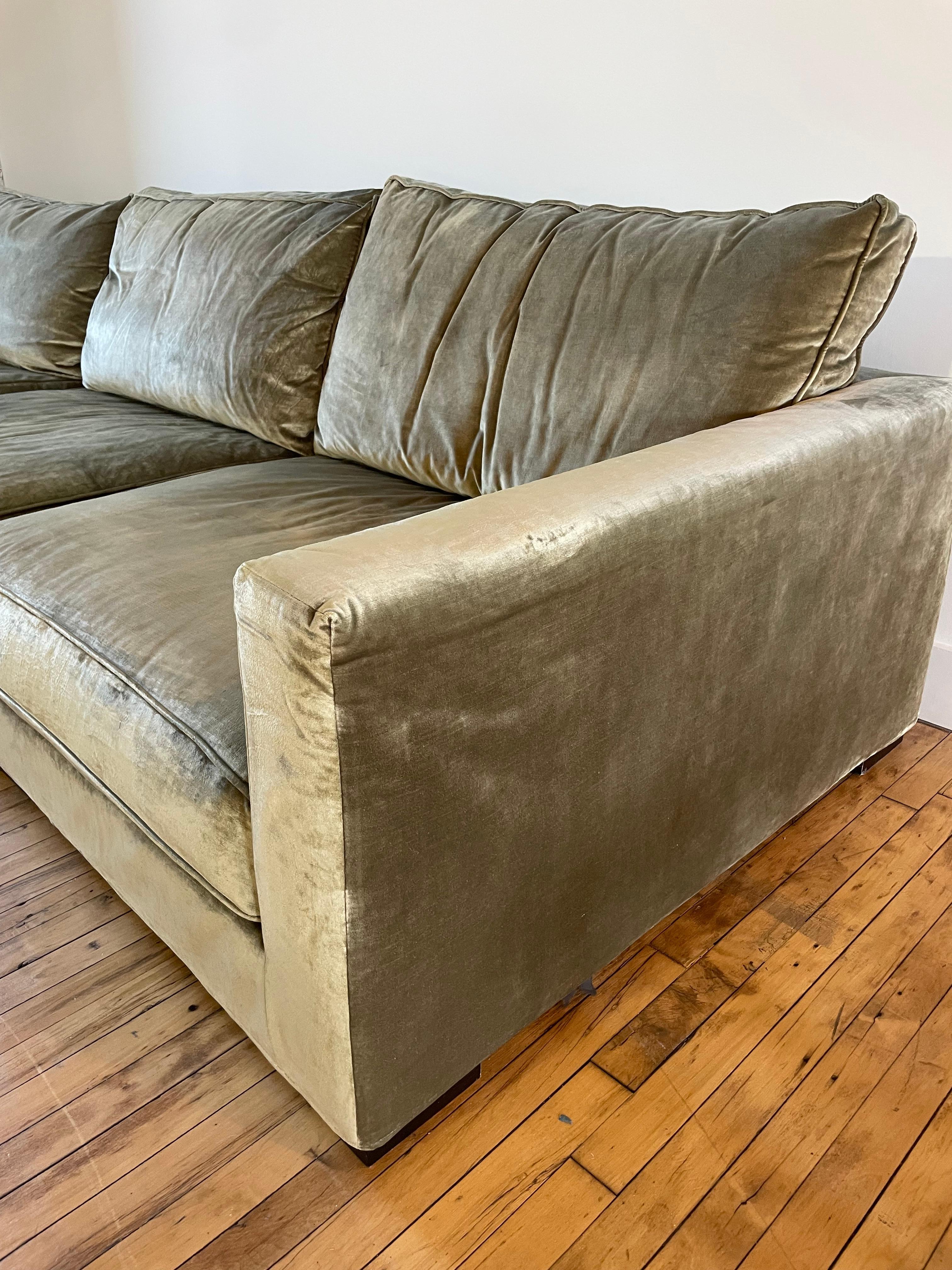 Stunning olive green couch from Roche Bobois in a luxurious chenille or velvet fabric.

This “Long Island” model currently retails for over $30,000. 

The fabric reflects light creating a luminous and rich appearance.

The couch is large and deep.