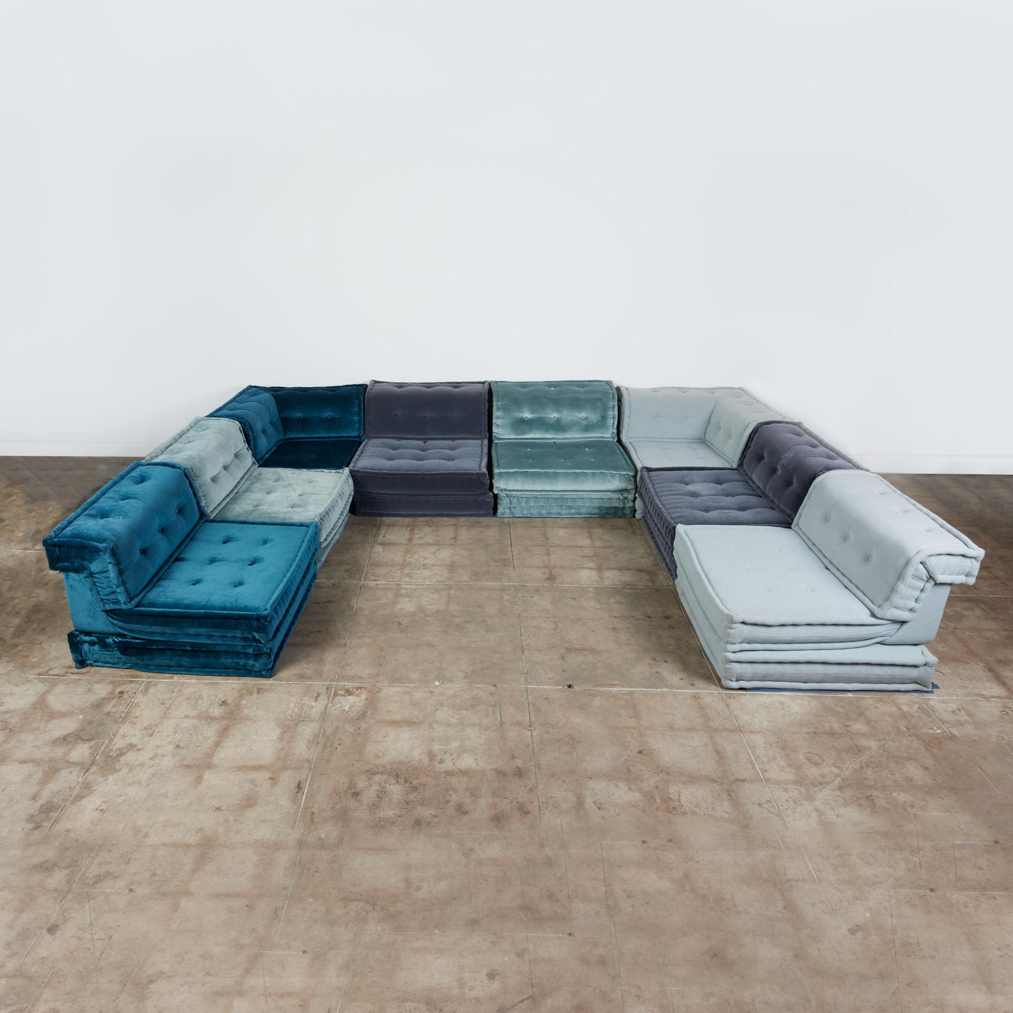 The Mah Jong sofa for Roche Bobois originally designed in the1970s by Hans Hopfer is a design that has endured. This example made in Italy, c.2019 has eight complete seats, two of which are corner seating units. The sofa has three different textures