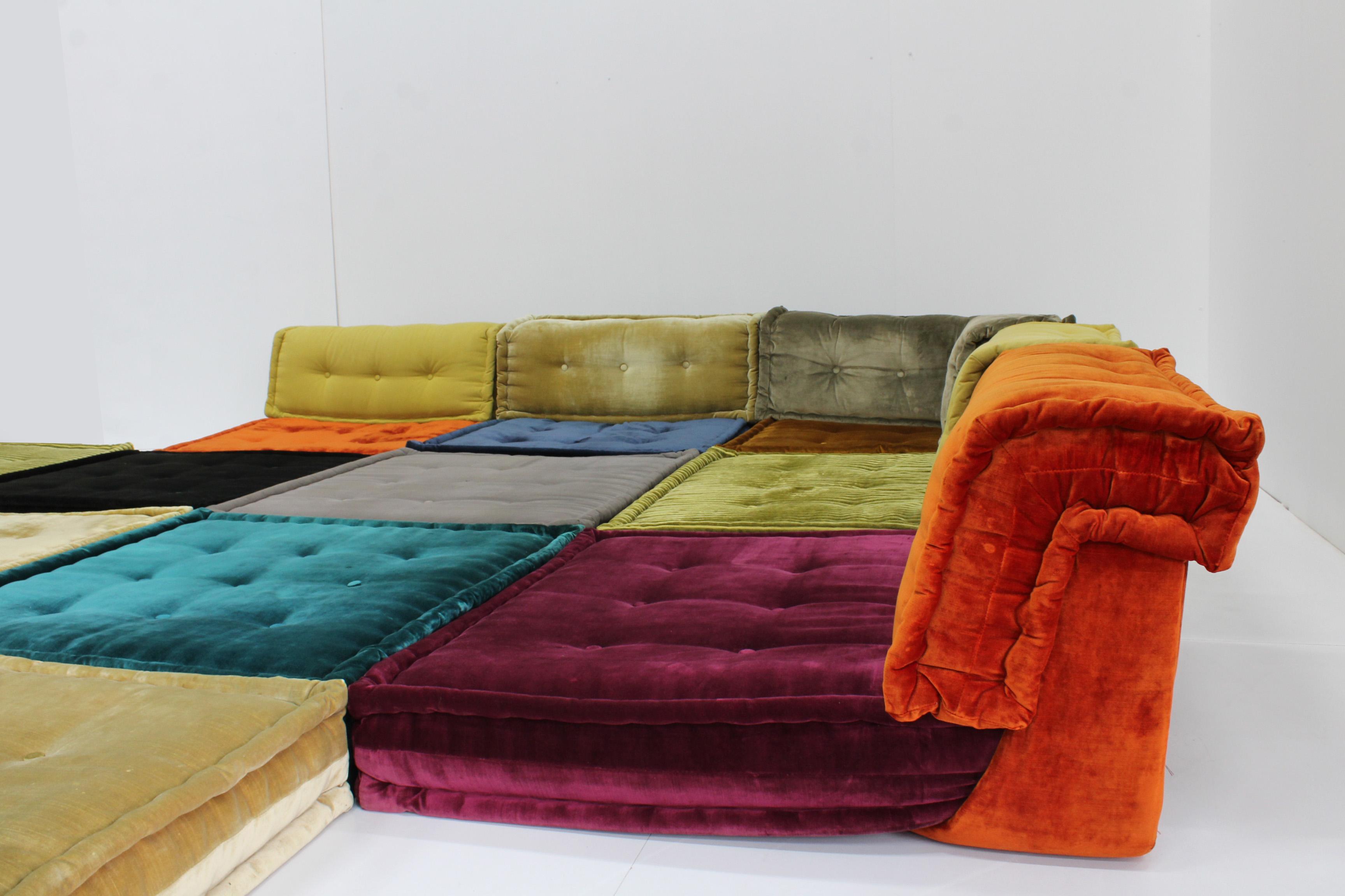 Roche Bobois Mah jong sofa consiting of 18 pieces designed in 1971 by Hans Hopfer. A modular design sofa with unlimited options which can be altered to your living space. Beautiful vibrant fabrics , textures and colours all made in Italy. Most of