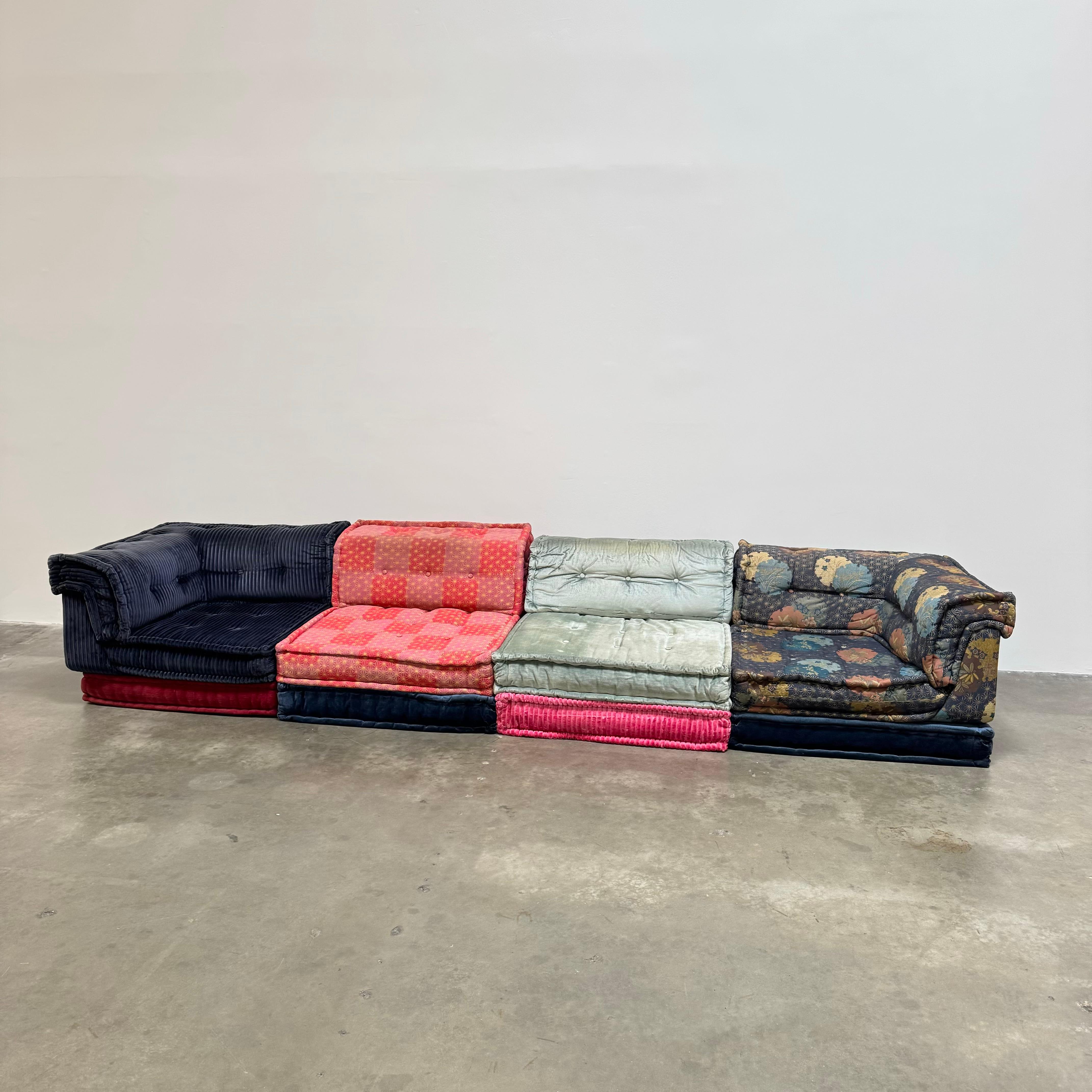 Presenting an exceptional 12-piece Mah Jong sofa by Roche Bobois, manufactured circa 2010, is a striking fusion of iconic design and high-end fabrics. 

Comprising modular elements that can be arranged in a variety of configurations, the sofa