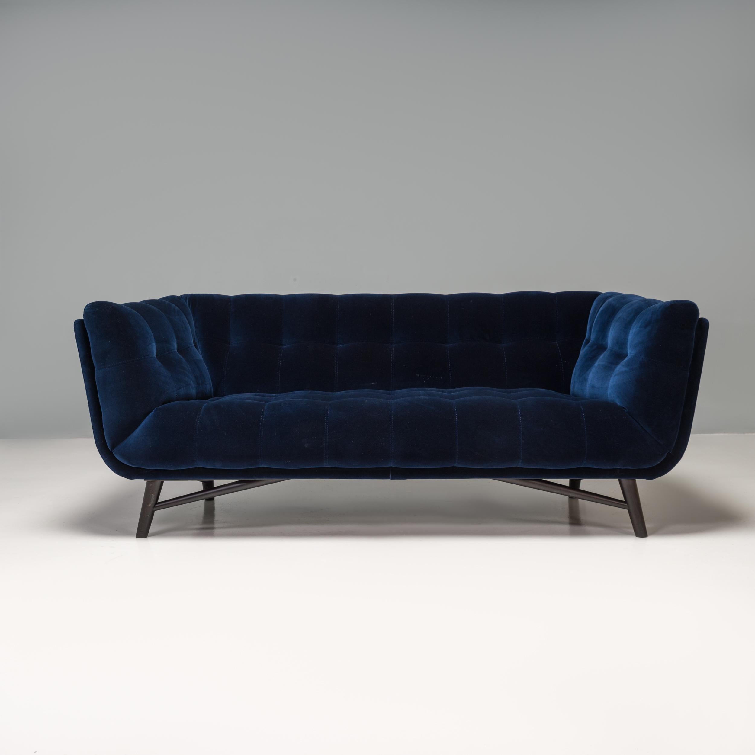 Designed by Roberto Tapinassi and Maurizio Manzoni for Roche Bobois, the Profile sofa offers a contemporary update on the classic Mid-Century Tuxedo style.

Constructed from a fir wood and pine ply structure, the sofa sits on four angular legs in