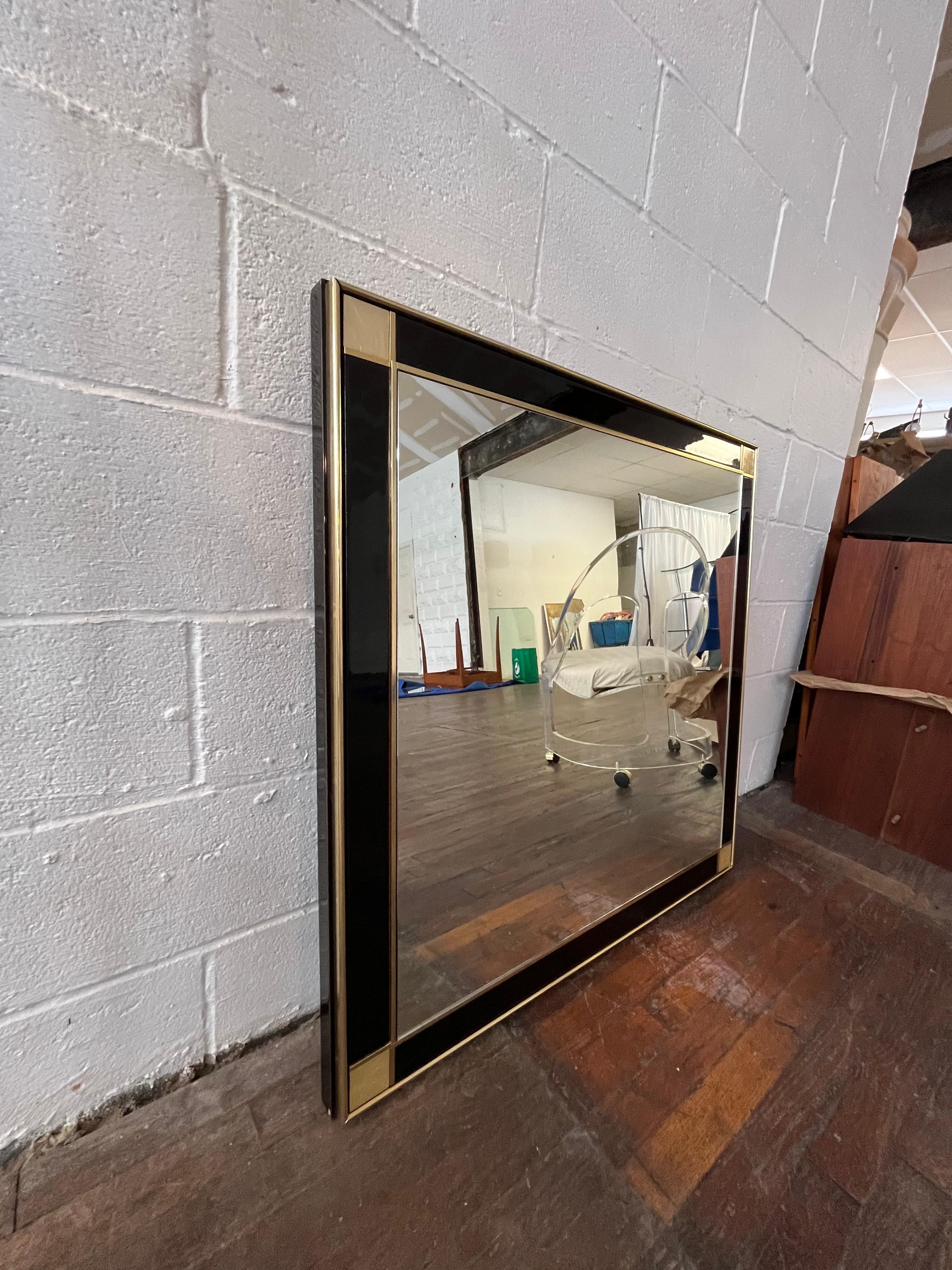 French black Lacquered mirror by Pierre Cardin. Manufactured by Roche Bobois. This piece features gilt brass trim throughout. The strong craftsmanship combined with the elegant lines add a sleek touch.
Curbside to NYC/Philly $350