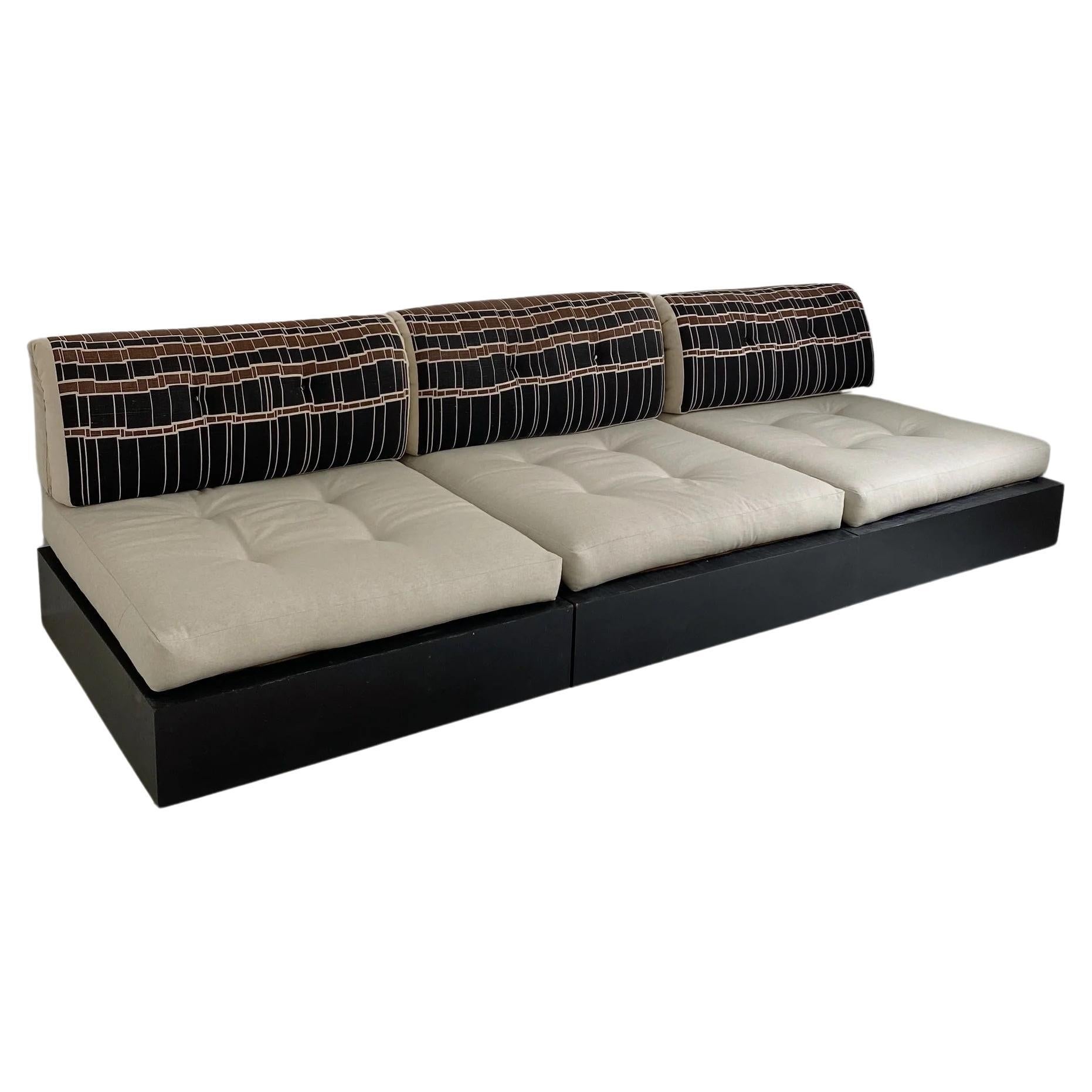 Linen Modular Sofa on Black Wooden Platform by Roche Bobois

Dimensions of each section measure: 
40”W x 40”D x 31”H  
Seat height 14