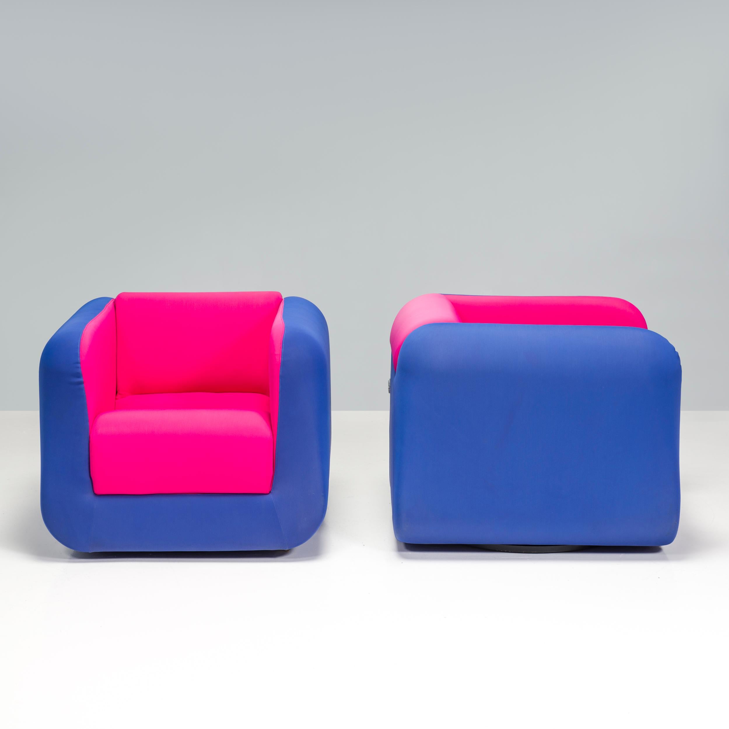 Designed and manufactured by Roche Bobois, this set of armchairs have a 1960s pop art aesthetic.

The armchairs have a square silhouette with softly rounded corners with the arms and backrest creating a cocoon-like effect.

The outside faces of the