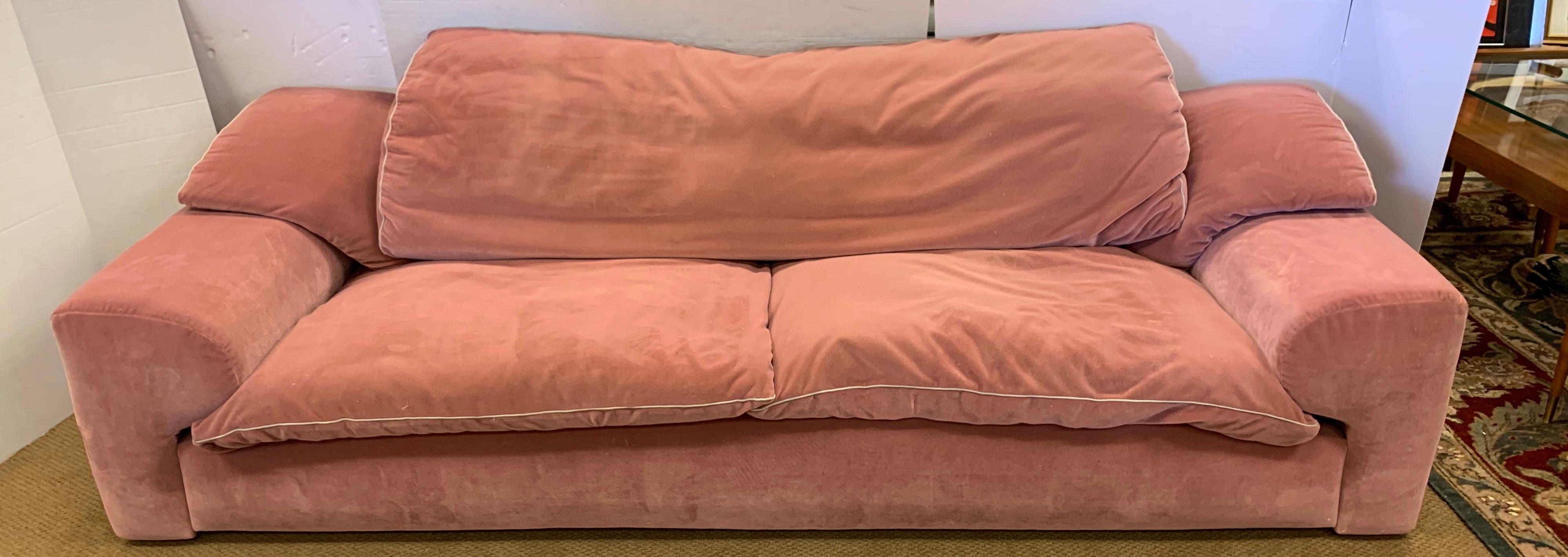 Postmodern signed Roche Bobois Furniture sofa. This sale is for a three-seat sofa. Features and extraordinary pale pink velvet fabric that is both luxurious and compelling, circa 1990s. This is a low profile piece that is very comfortable and comes,