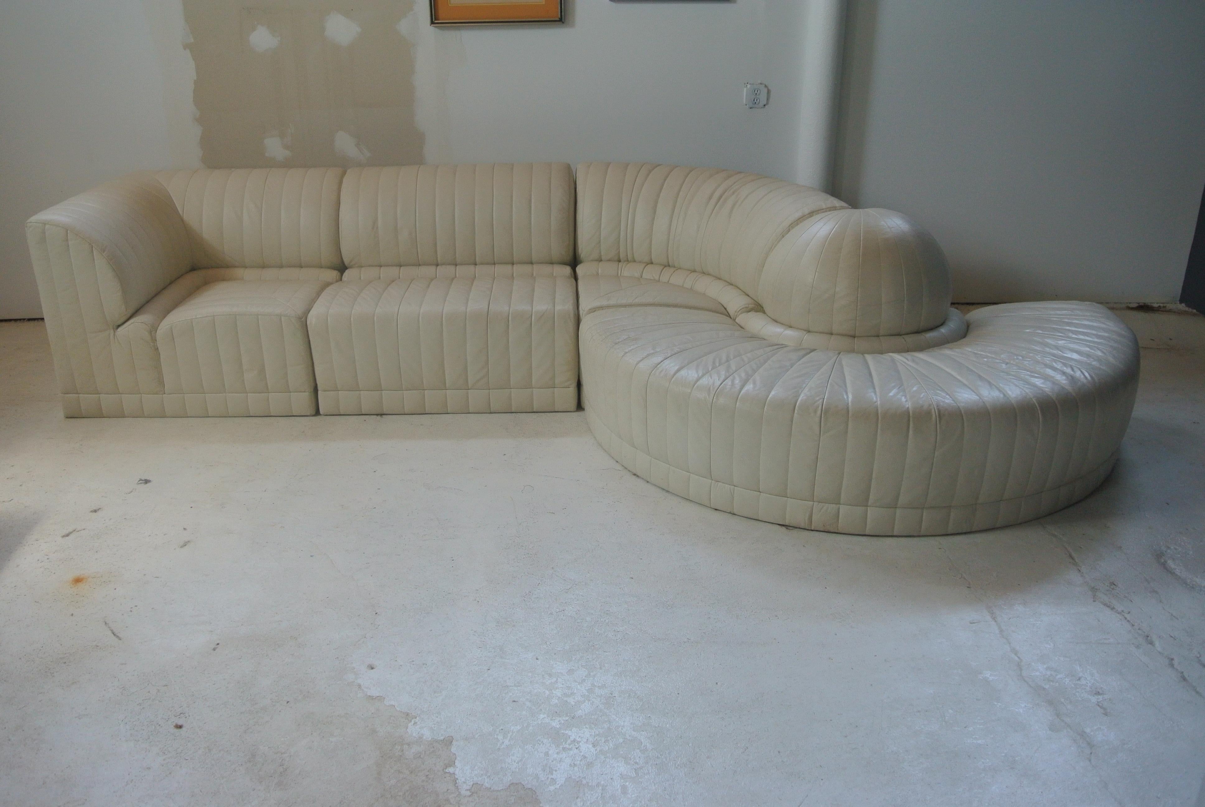 Beautiful four-piece white leather sectional by Roche Bobois. Pieces are interchangeable and can be shaped to fit any design.